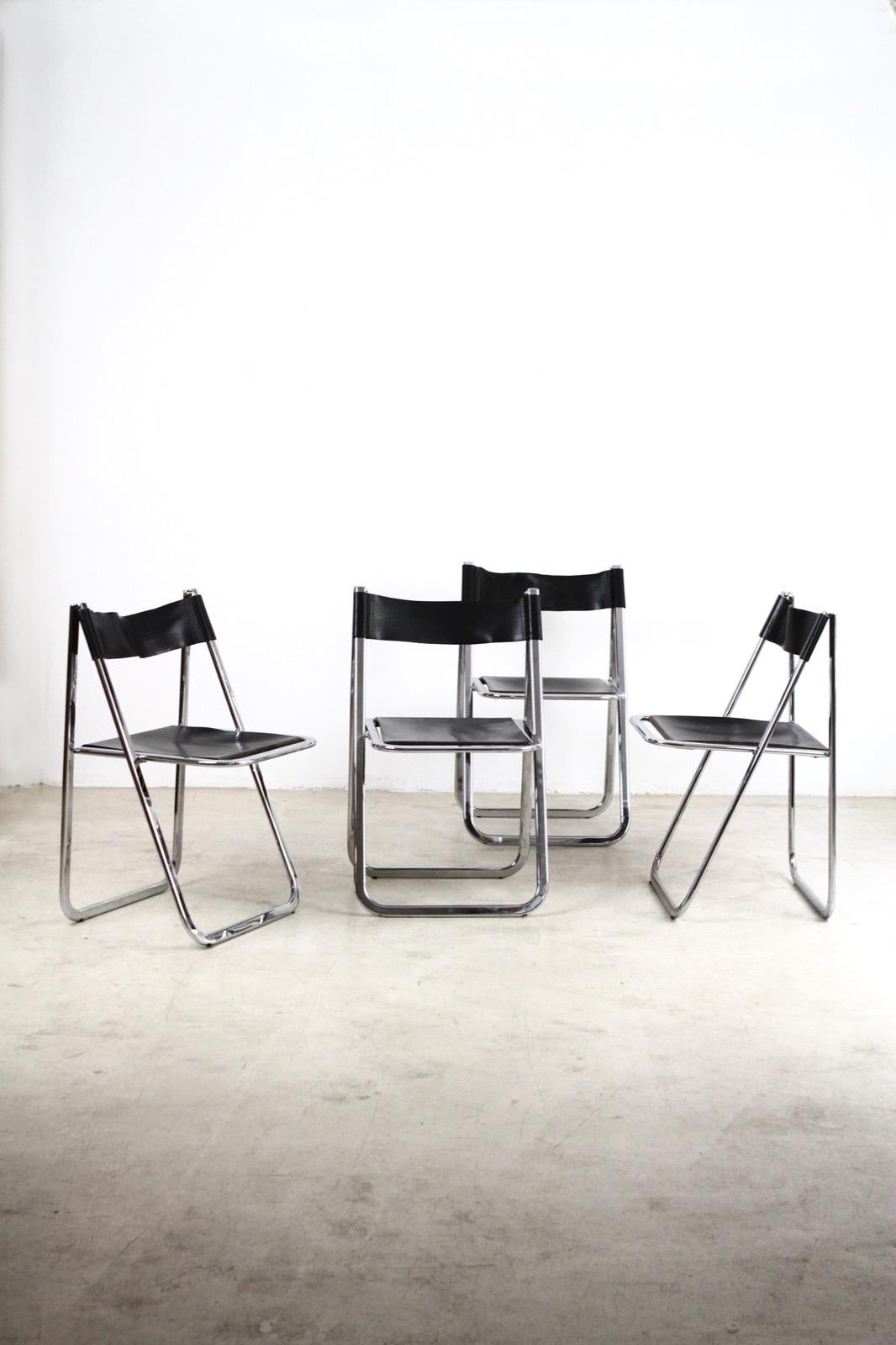 These Tamara folding chairs by Italian maker Arrben are the quintessential example of the form in split leather and chrome-plated steel polished to a mirror finish. We call them 