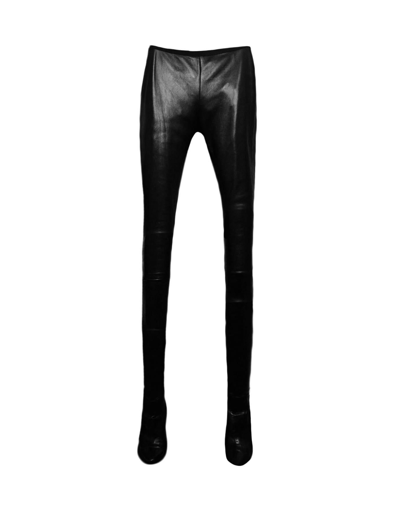 Tamara Mellon Black Leather Sweet Revenge High-Heel Legging Boots sz 37 XS

Made In: Italy
Color: Black
Materials: Leather
Lining: Fabric
Closure/Opening: Slip on
Overall Condition: Excellent pre-owned condition, with the exception of some minor