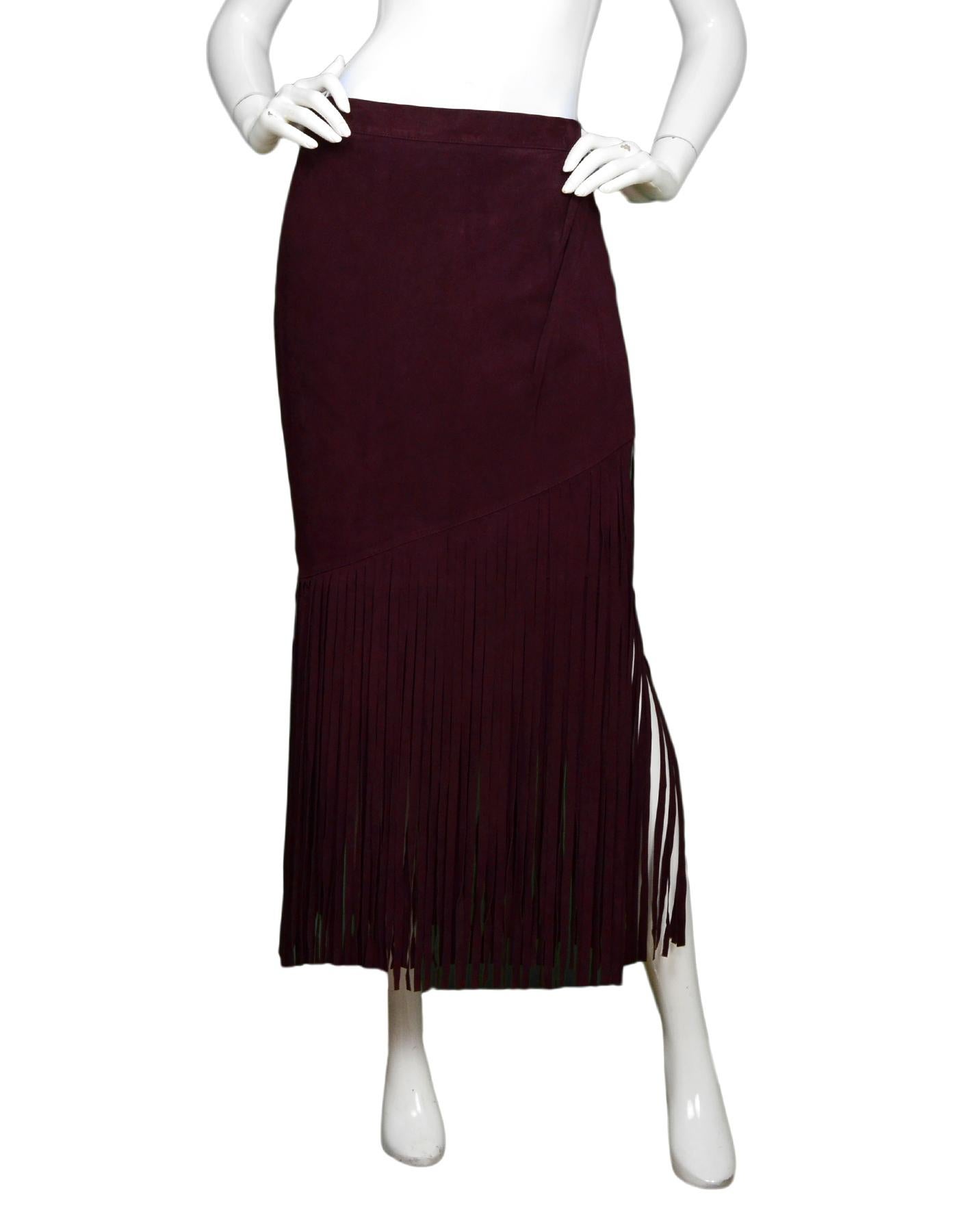 Tamara Mellon Burgundy Suede Fringe Skirt NWT Sz 12

Made In: India  
Color: Burgundy 
Materials: 100% real goat suede
Lining:  100% polyester 
Closure/Opening: Hidden back zipper with two hooks and one button at top
Overall Condition: Excellent