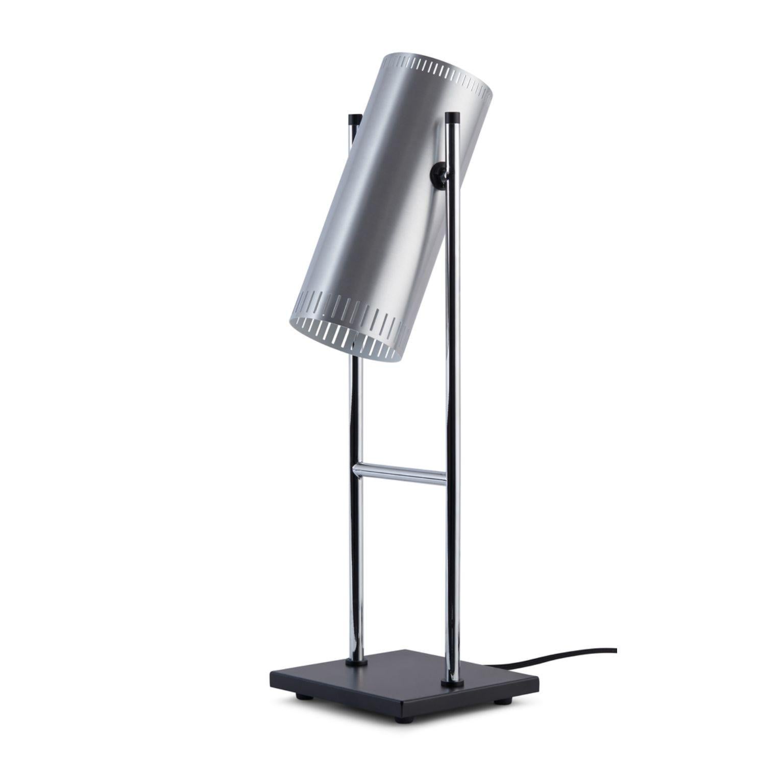 Tambone aluminium table lamp by Warm Nordic
Dimensions: D 16 x W 16 x H 56 cm
Material: Brushed aluminium
Weight: 2 kg
Also available in different finishes.

Warm Nordic is an ambitious design brand anchored in Nordic design history and with a