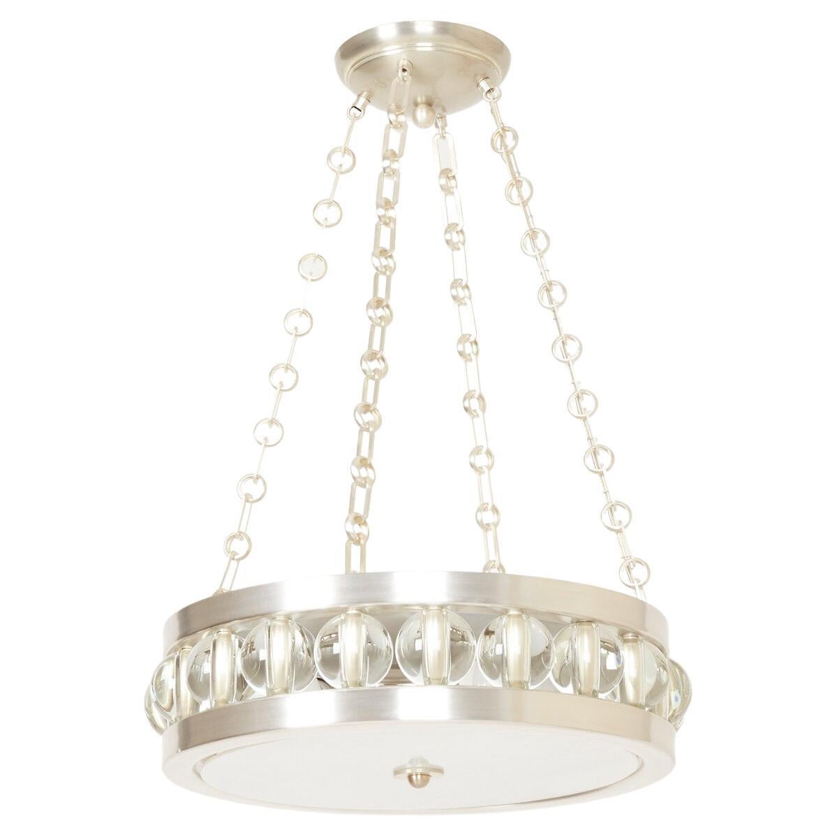A round Tambour fixture with chain. The metal frame securing a flat piece of white swirl glass with finial in center on underside. The sides with over-scaled Murano glass beads.

Drop is adjustable with a minimum drop of 12