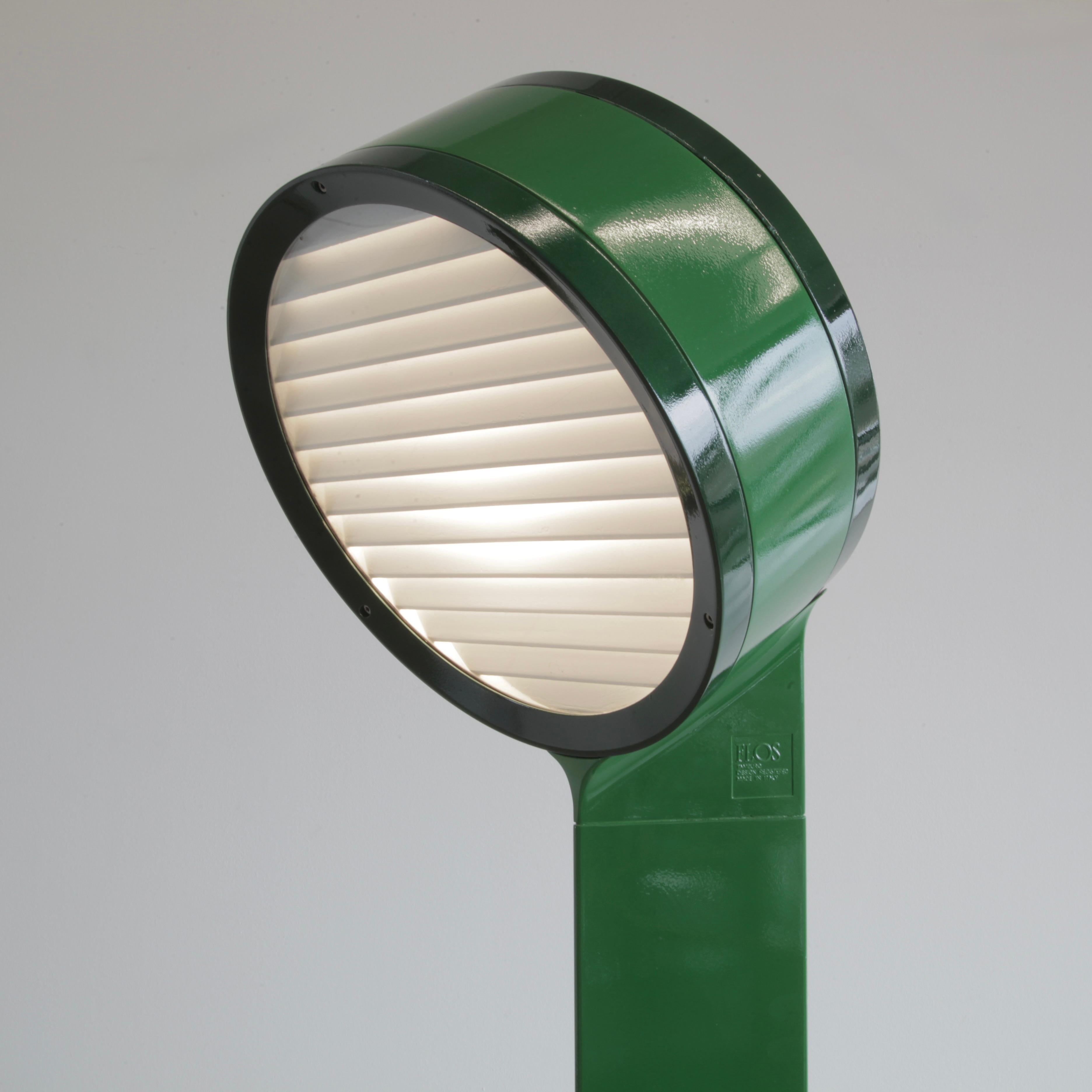 Small Floor/ Table lamp designed by Afra & Tobia Scarpa. Italy, FLOS, 1973.

The TAMBURO light designed for inside and outside spaces. Cast aluminium, light- and medium green coloured base and lamp with plexiglass reflector, rubber seals and a