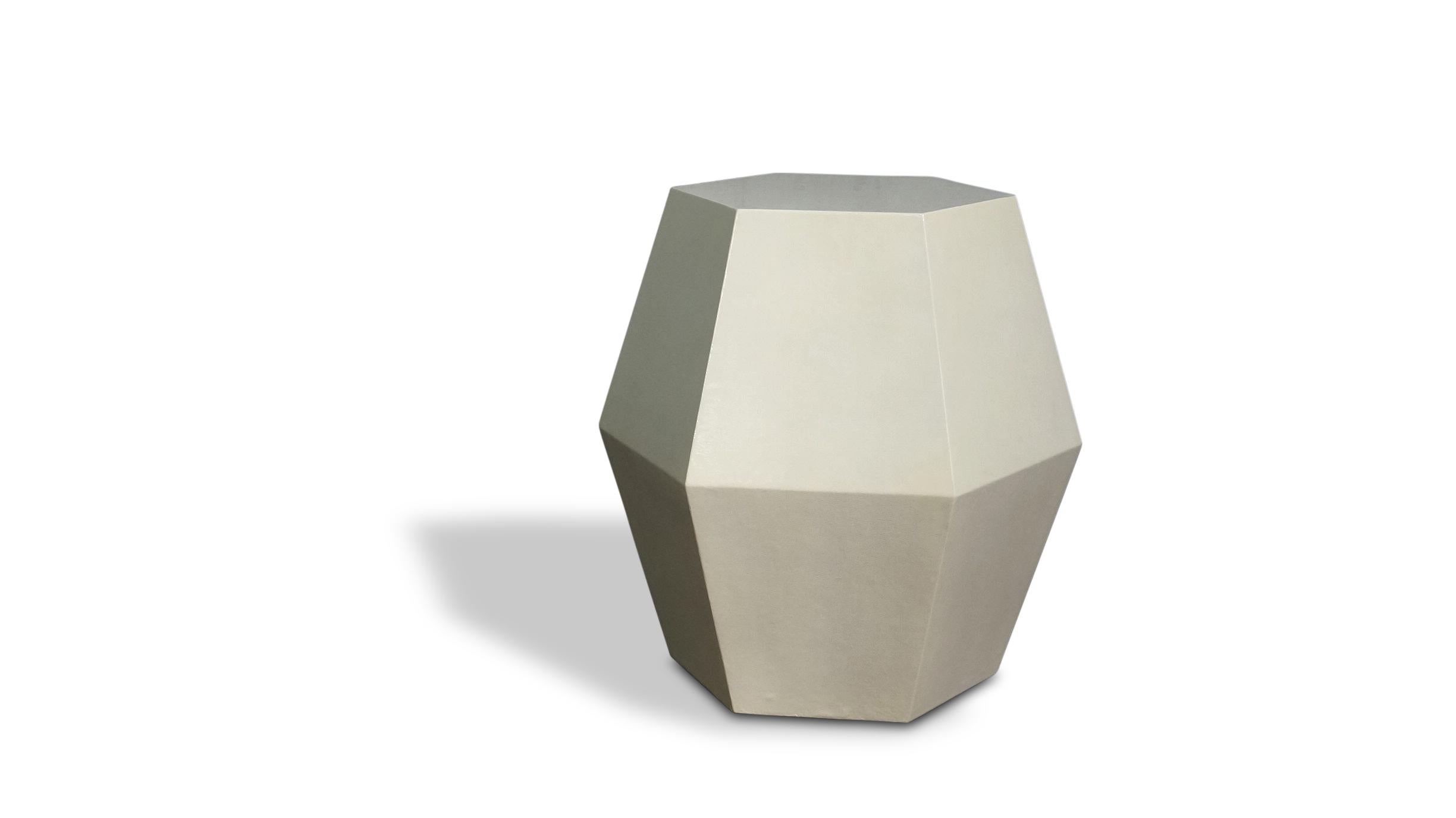 The name of the Tamino Hex comes from its hexagonal shape and can be specified in any of Costantini’s available materials and finishes. Available here in faux parchment, these side tables feature a modern, geometric shape that allows the subtle