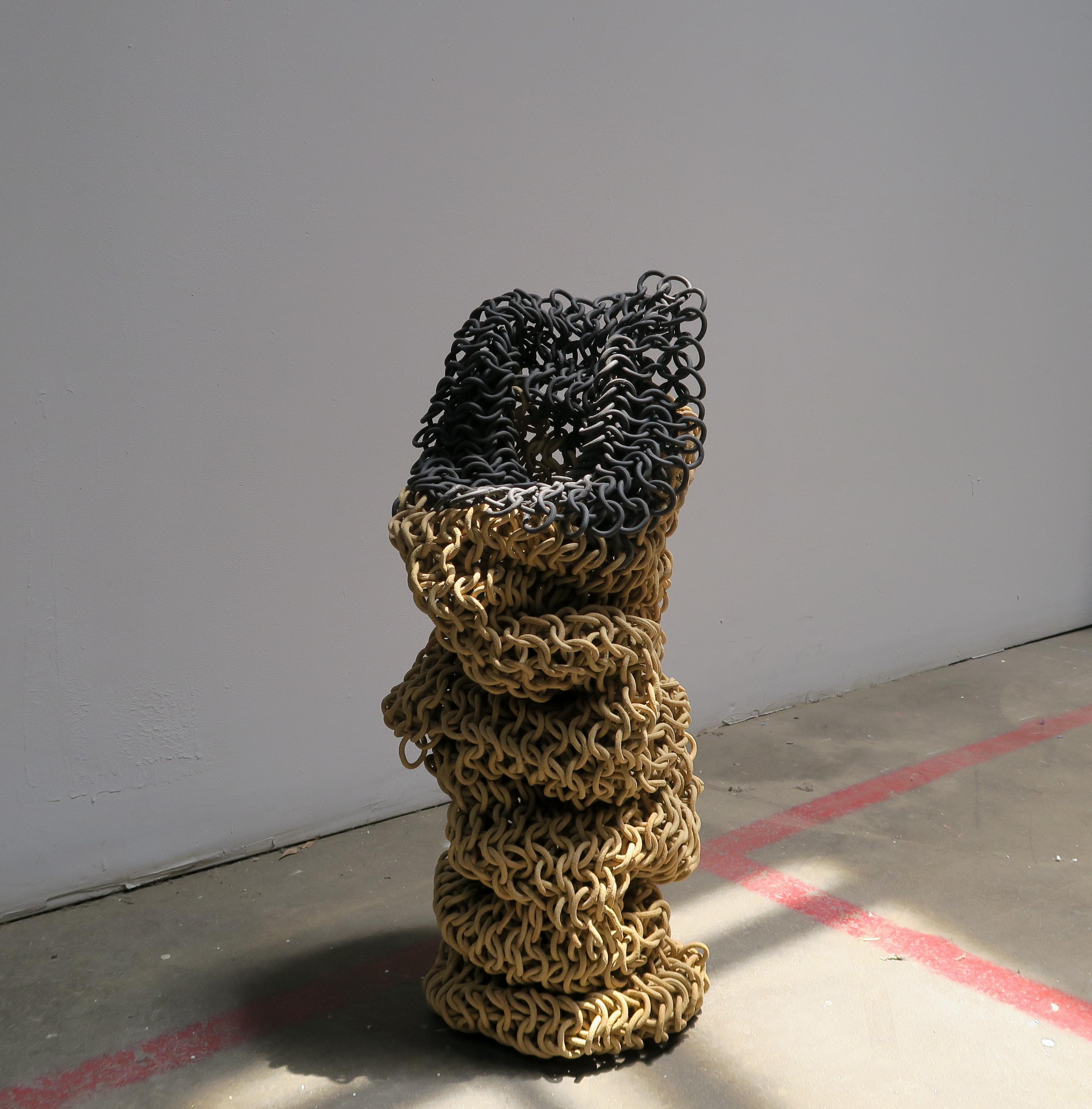 This wall sculpture balances the strength and delicacy of its materiality through the lush draping of seemingly fragile ceramic links. Each link is individually assembled into a vast weaving of ceramic rings that allows the piece to drape, fold, and