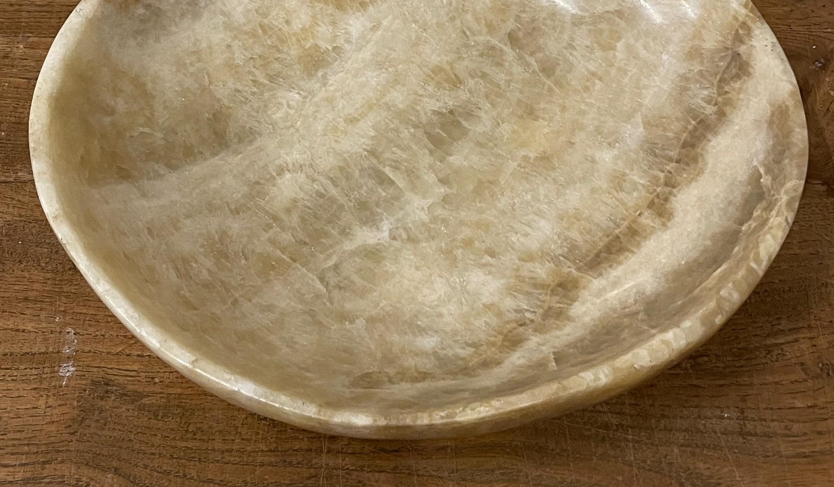 Contemporary Indonesian onyx bowl.
Tan and cream in color.
Polished finish.
Several available in assorted sizes and patterns:
12