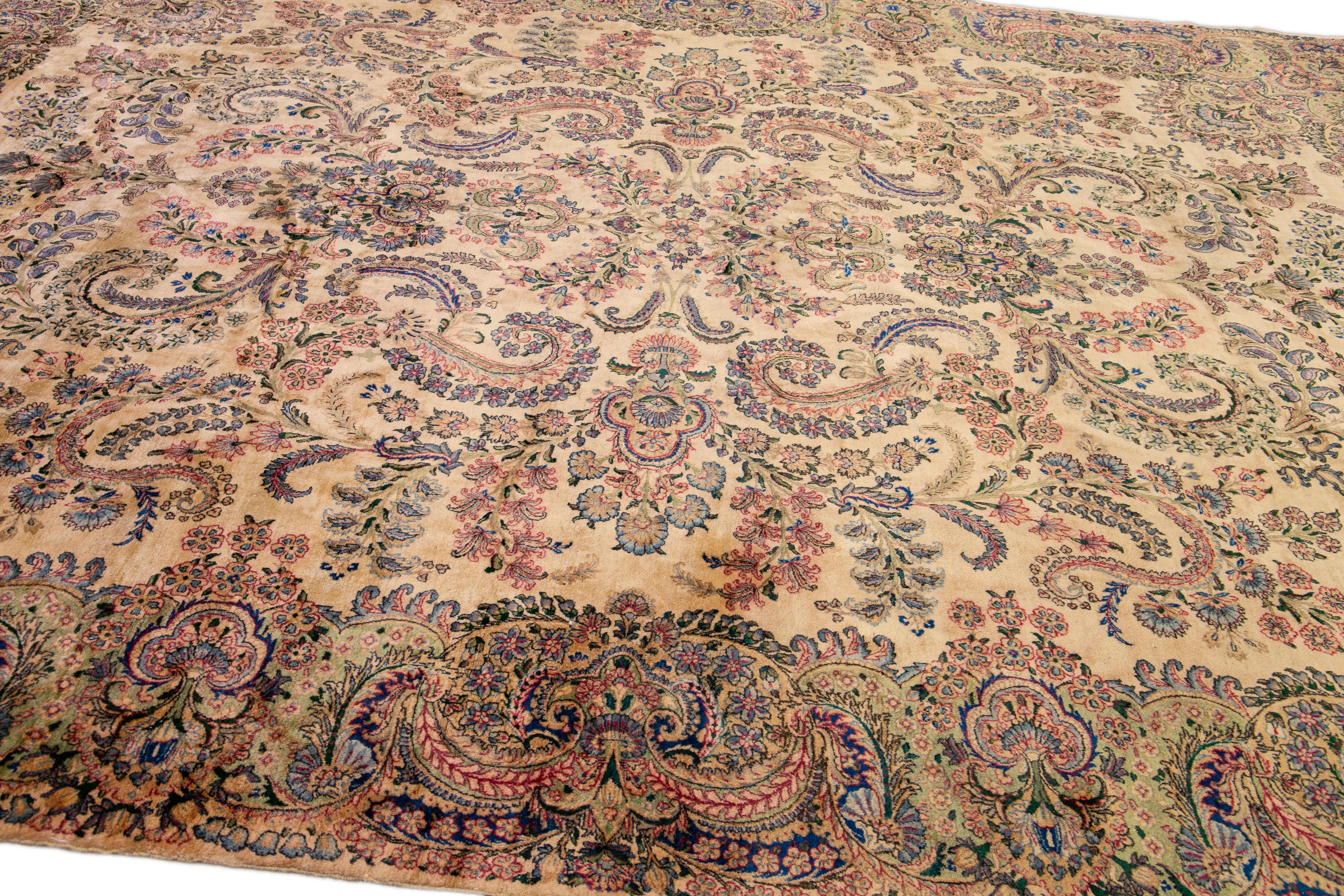 Early 20th Century Tan Antique Kerman Handmade Allover Floral Designed Wool Rug For Sale