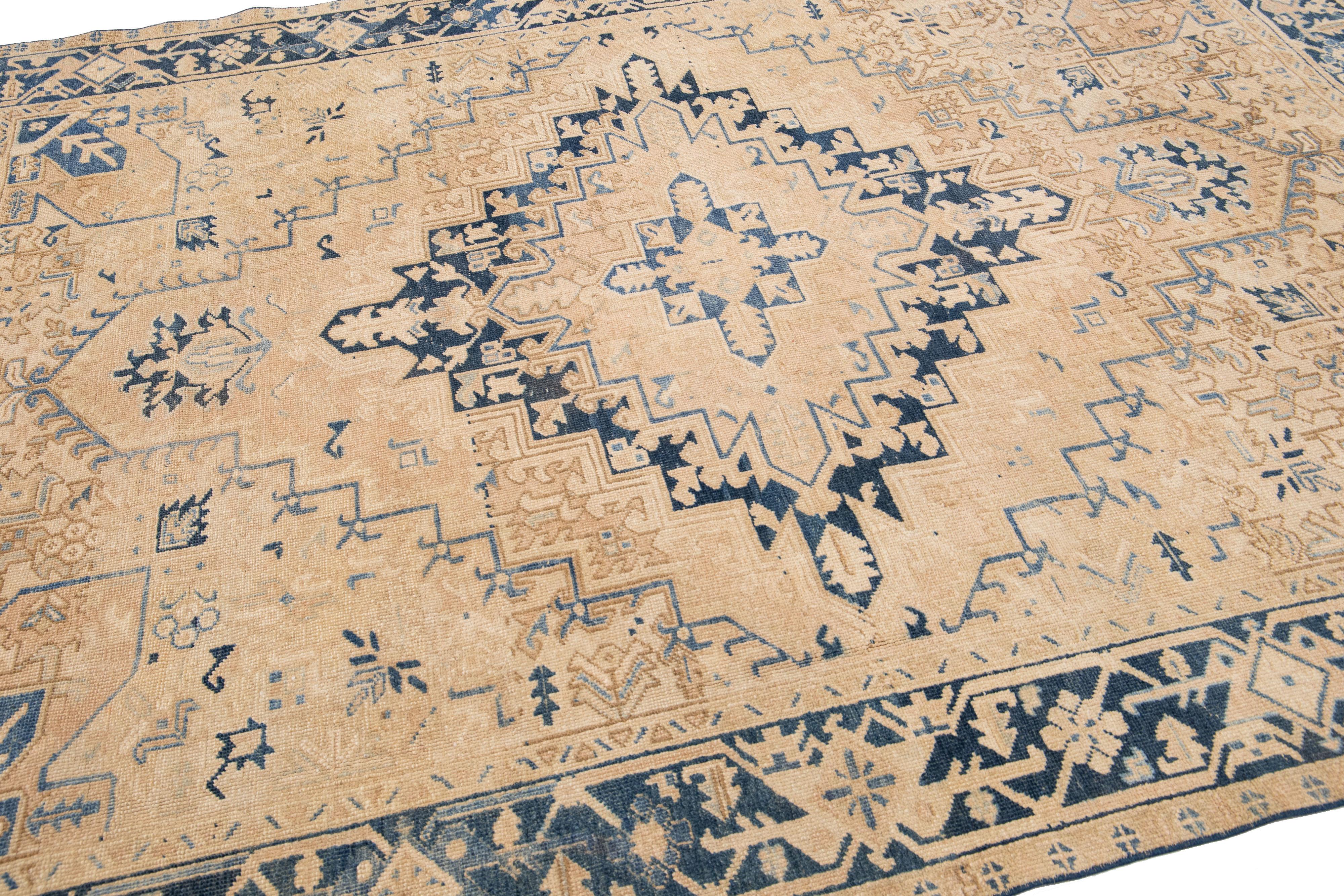 Early 20th Century Tan Antique Persian Heriz Handmade Wool Rug with Medallion Design For Sale
