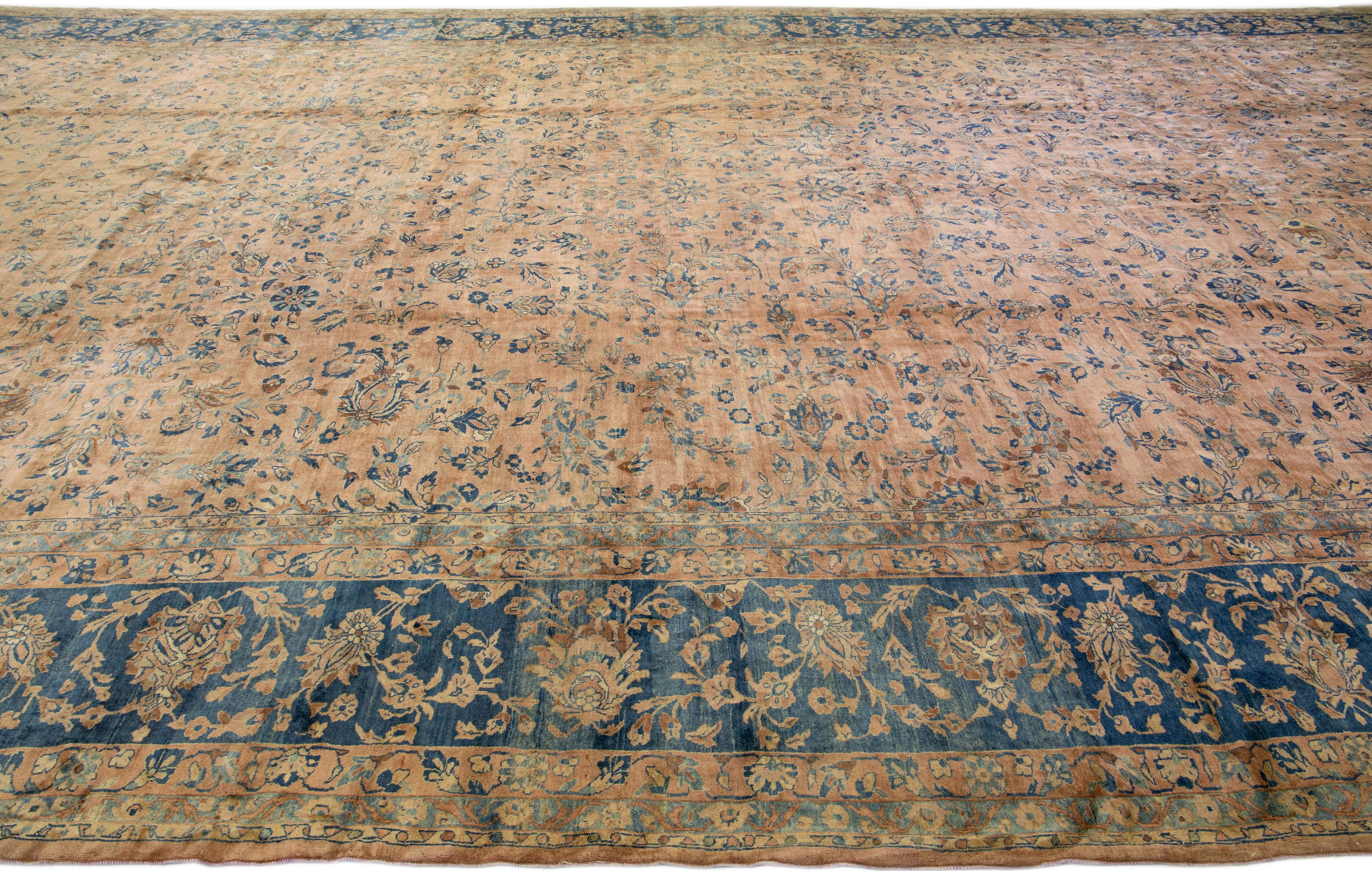Tan Antique Tabriz Handmade Oversize Persian Wool Rug with Floral Design In Good Condition For Sale In Norwalk, CT