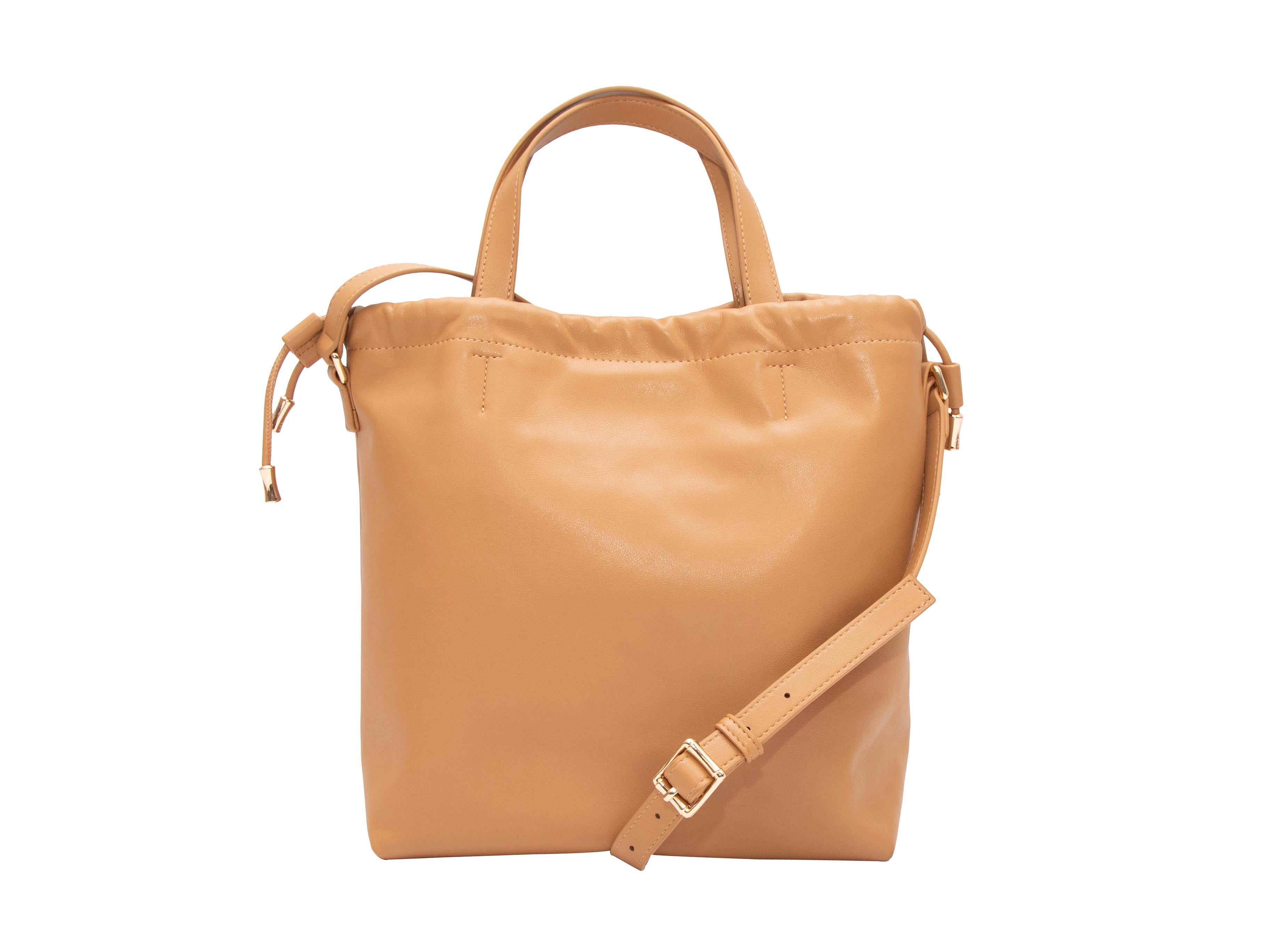 Tan A.P.C. Leather Shoulder Bag. This bag features a leather body, gold-tone hardware, dual flat top handles, a single flat shoulder strap, and a top drawstring closure. 12