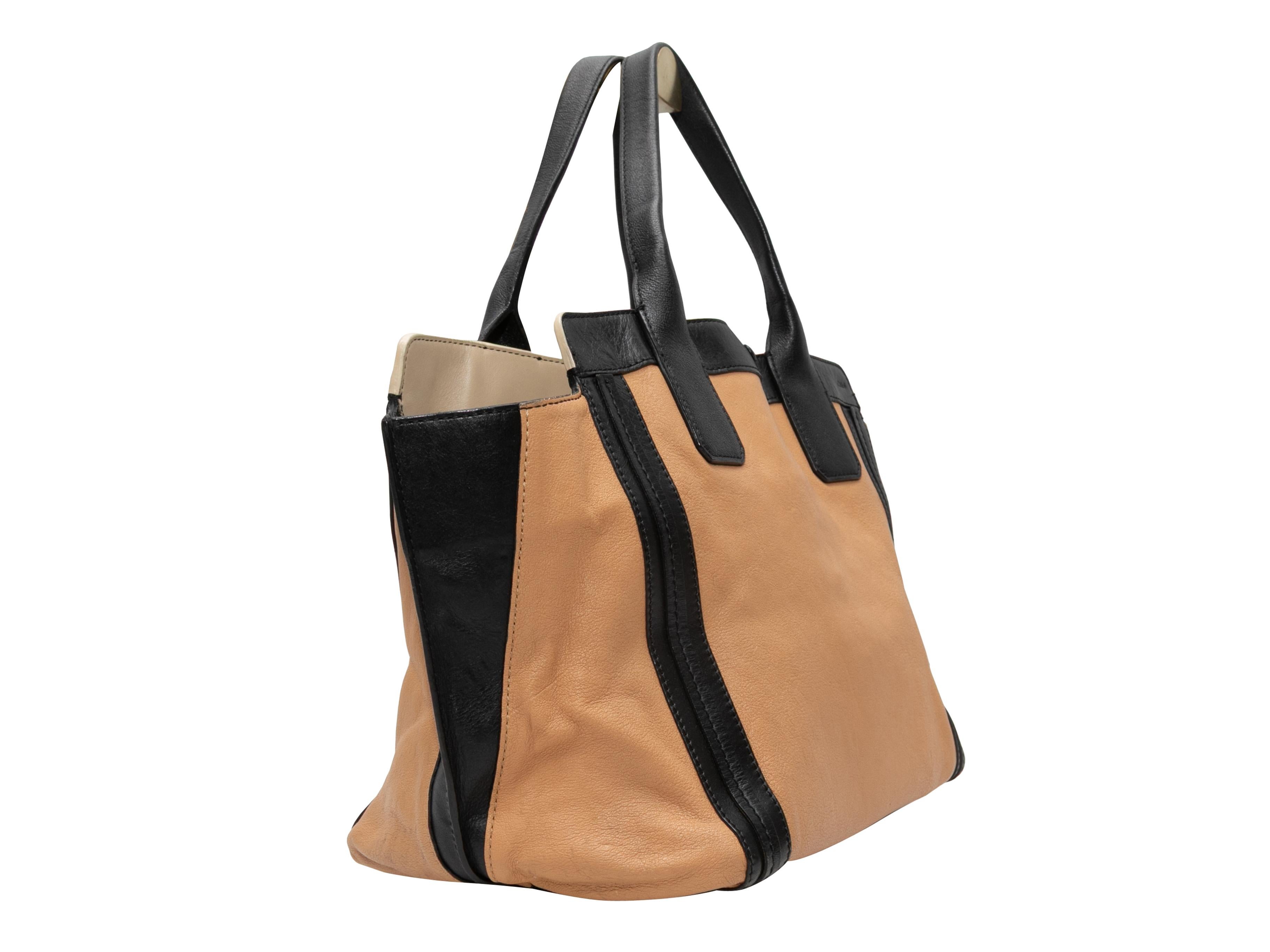 Tan & Black Chloe Medium Leather Tote Bag. This tote bag features a leather body, gold-tone hardware, dual flat top handles, and a top closure. 17