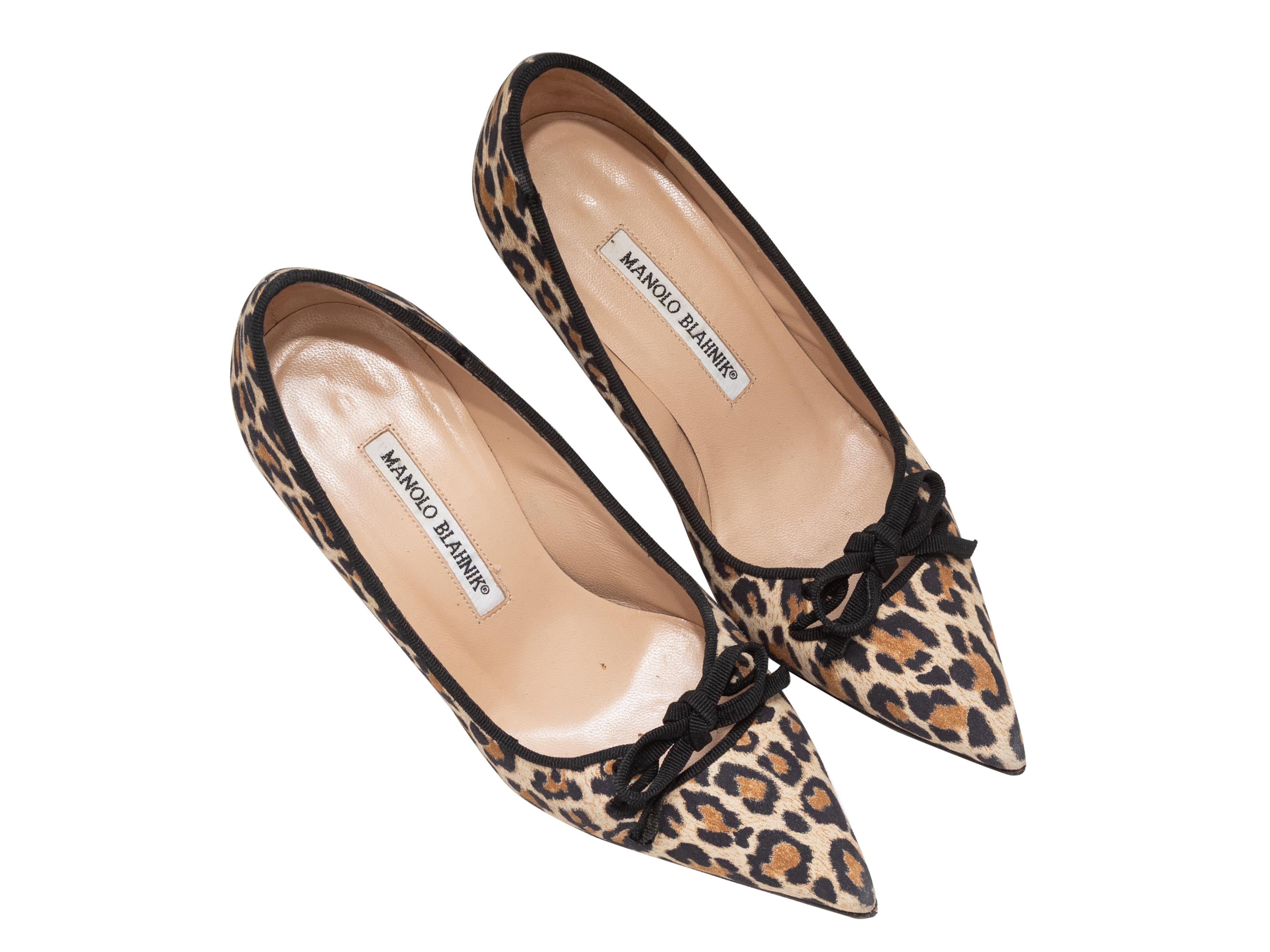 Tan and black leopard print pointed-toe pumps by Manolo Blahnik. Bow accents at tops. 3