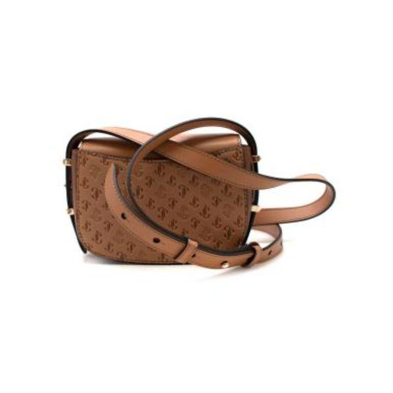 Jimmy Choo tan embossed leather Varene crossbody bag
 
 - Flap opening leather crossbody featuring logo-embossed leather with a pearlescent finish
 - Opens to a suede-lined interior with slip pocket and logo plaque
 - Adjustable crossbody strap
 -