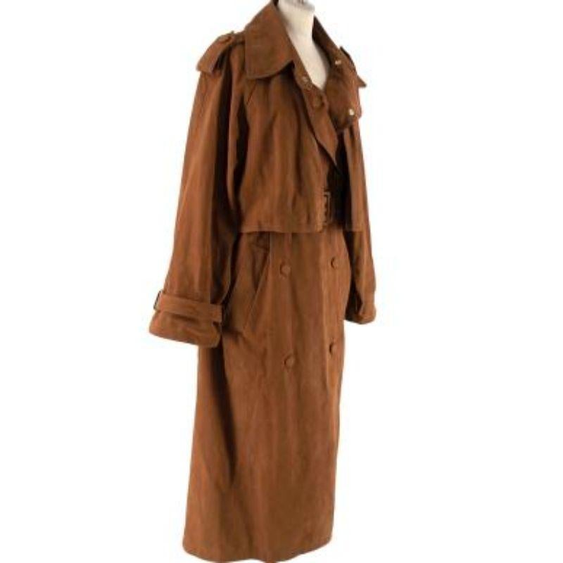 Stella McCartney Tan faux-suede trench coat
 
 
 
 - Faux-suede 'skin free skin' outer in a rich tan hue
 
 - Classic trench styling with storm cape, shoulder epaulets, and belted cuffs and waistline
 
 - Vented back for extra movement
 
 - Unlined