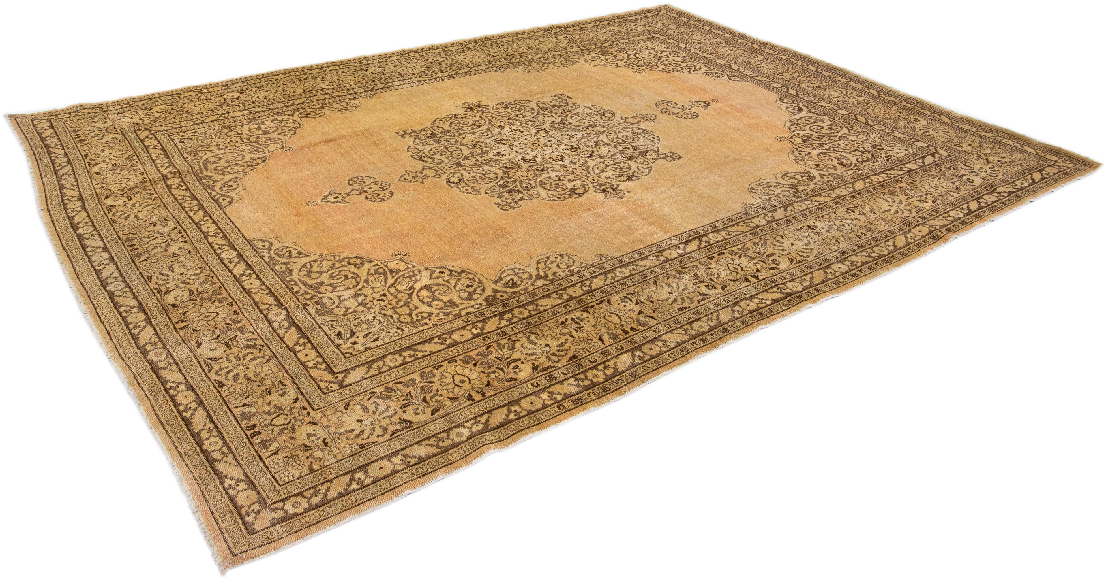 Tan Handmade Antique Persian Tabriz Wool Rug with Medallion Motif In Good Condition For Sale In Norwalk, CT
