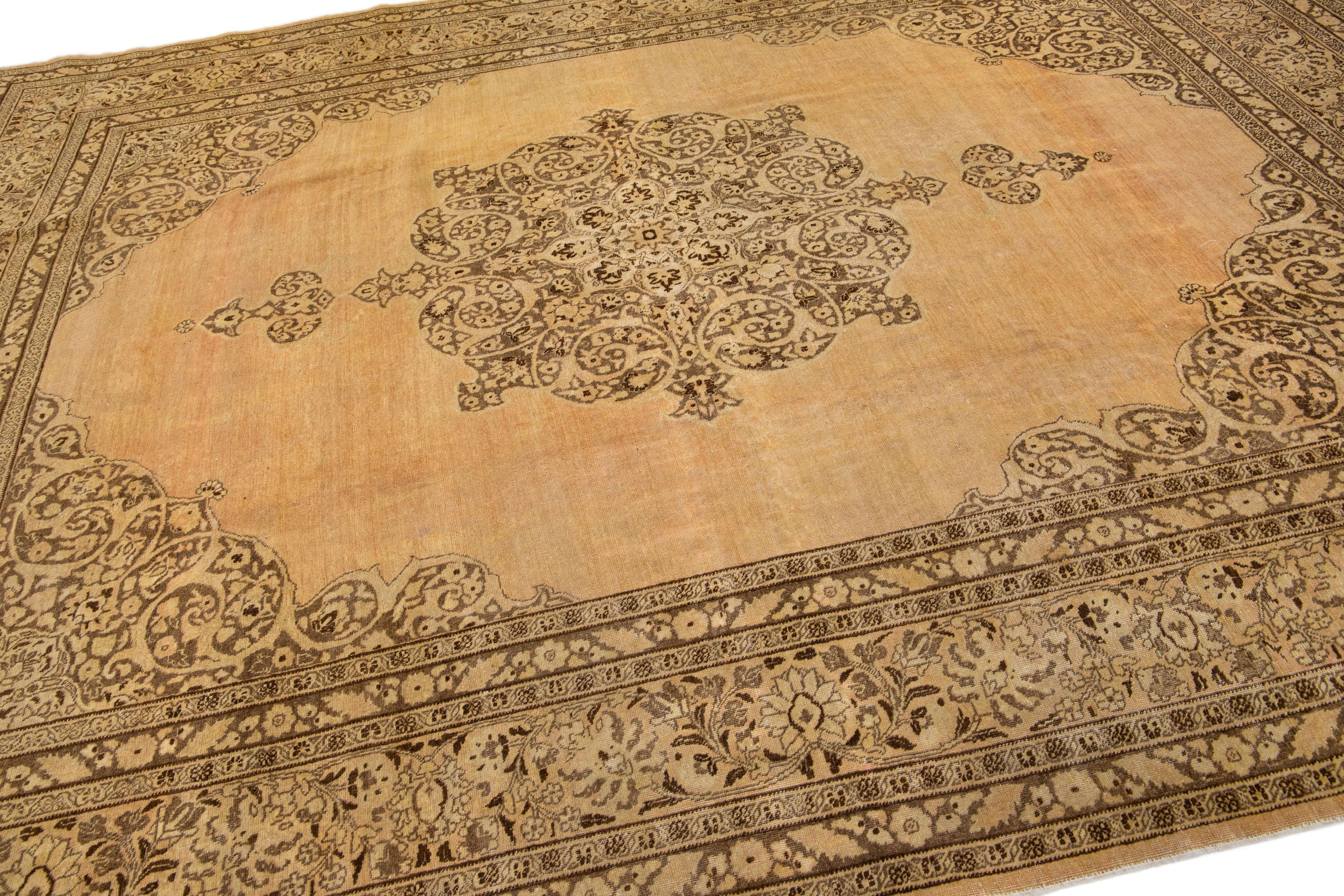 Tan Handmade Antique Persian Tabriz Wool Rug with Medallion Motif For Sale 1
