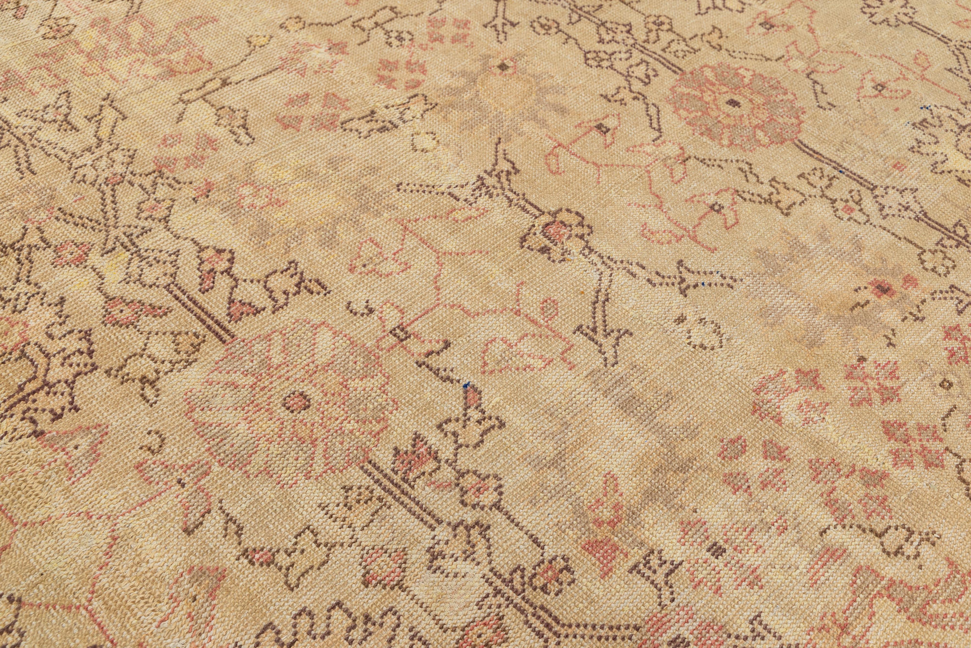 Tan Handmade Turkish Oushak Wool Rug Featuring a Floral Motif In Good Condition For Sale In Norwalk, CT