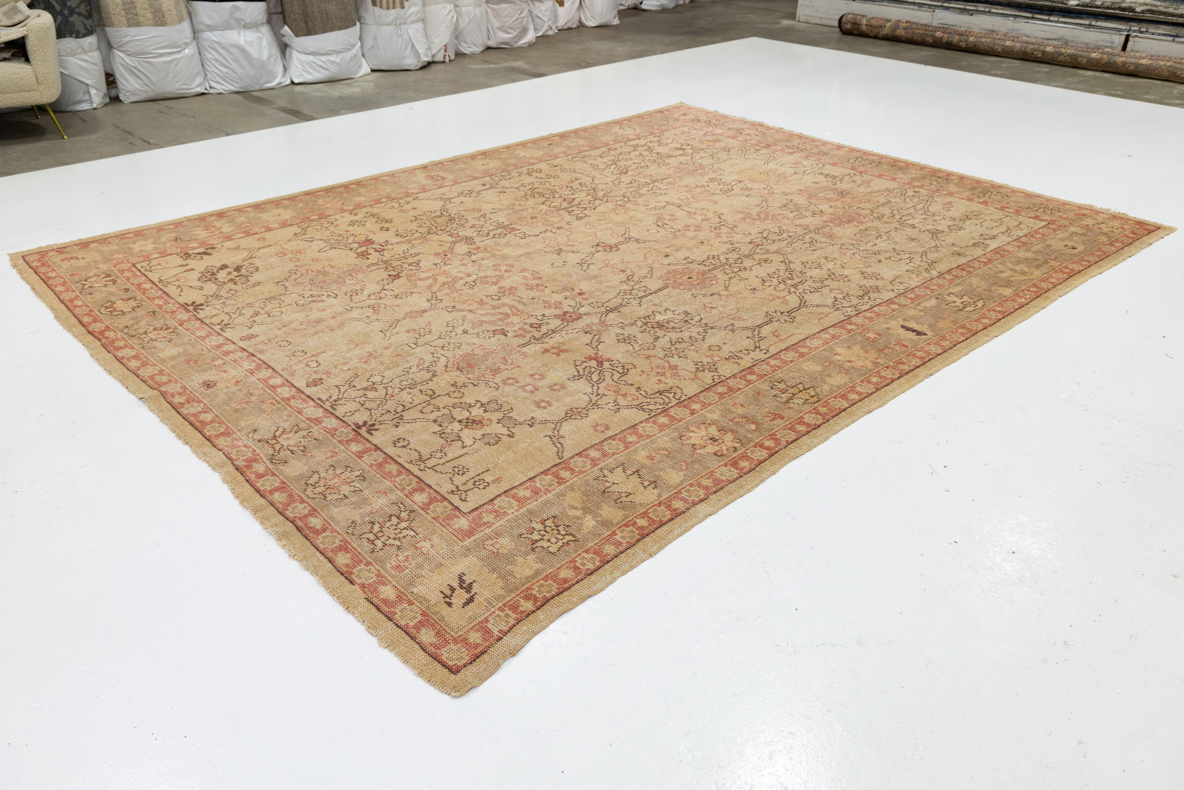 20th Century Tan Handmade Turkish Oushak Wool Rug Featuring a Floral Motif For Sale