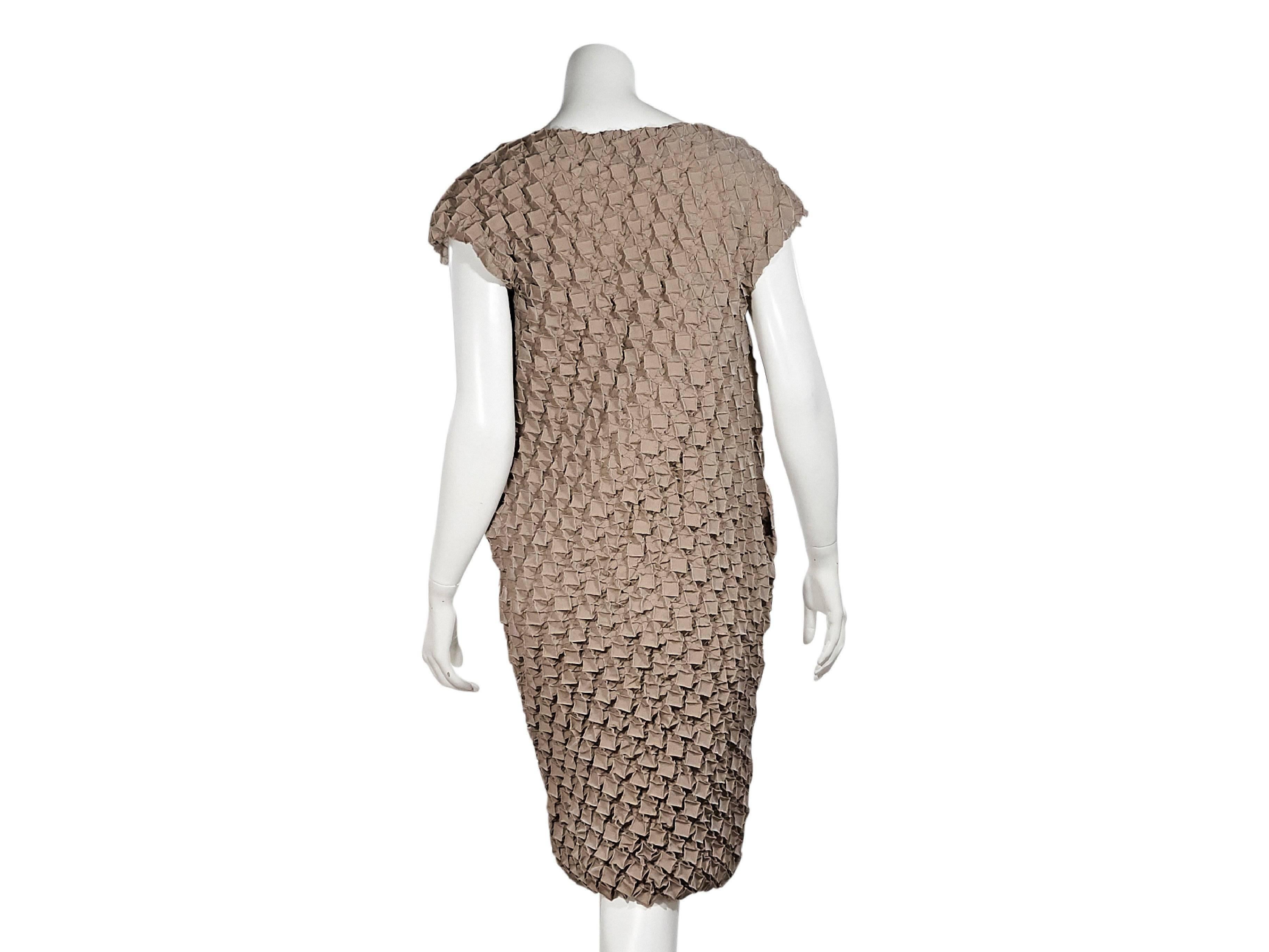Product details:  Tan textured shift dress by Issey Miyake.  Short dolman sleeves.  Pullover style.  44