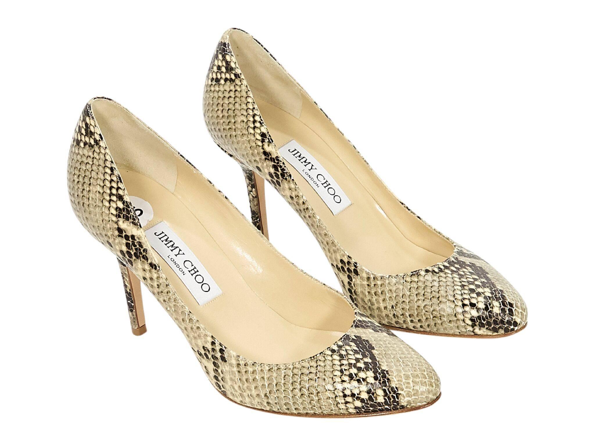 Product details:  Exotic tan snakeskin pumps by Jimmy Choo. Round toe.  Slip-on style. 
Condition: Pre-owned. Very good. 
Est. Retail $695