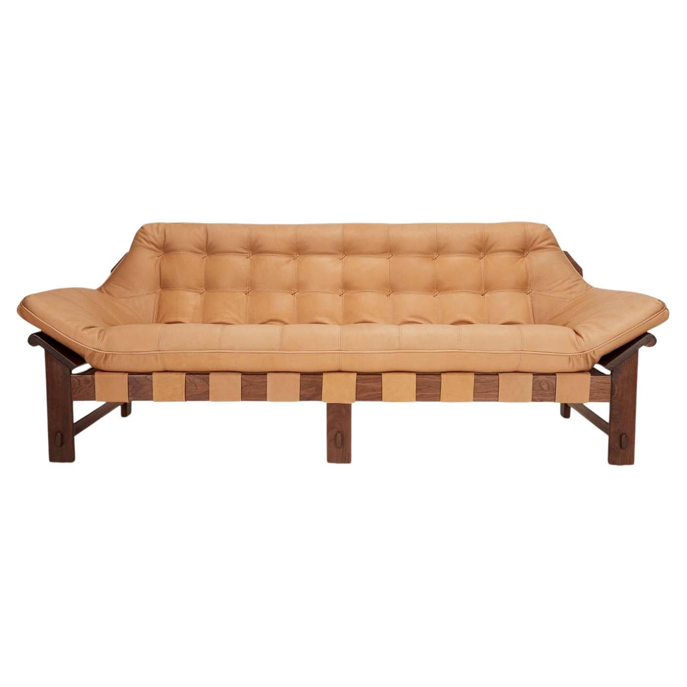 The Ojai sofa features a solid white oak or solid walnut base and a single tufted leather cushion with leather straps. Shown here in deer tan leather and oiled walnut. 

The Lawson-Fenning Collection is designed and handmade in Los Angeles,