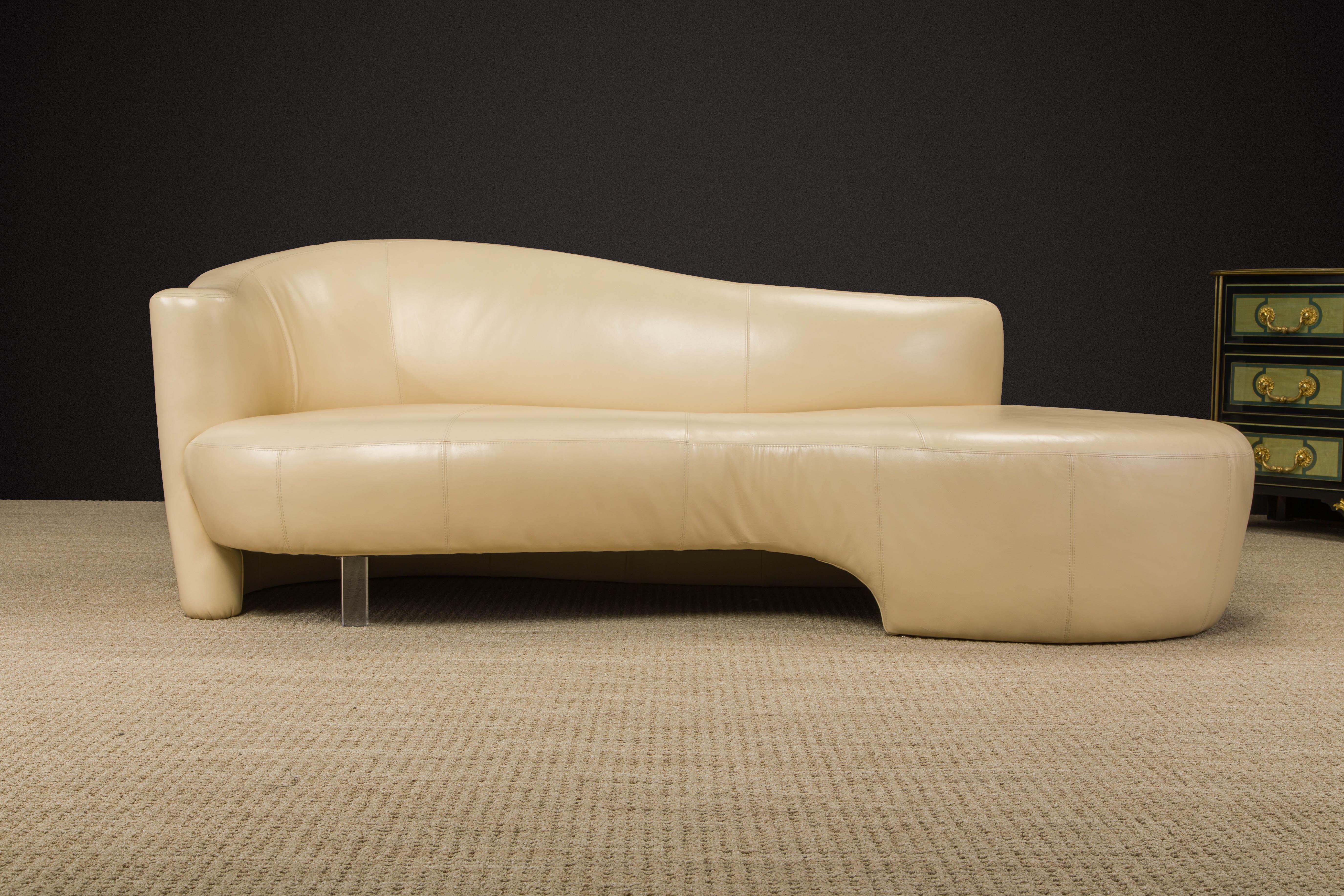 This beautiful curvy and fluid Post-Modern sofa by Weiman is in soft and luxurious tan colored leather, features a single lucite leg and is signed underneath with a Weiman label.  

Designed by Robert L. Ebel and produced by Wieman in the 1980s and