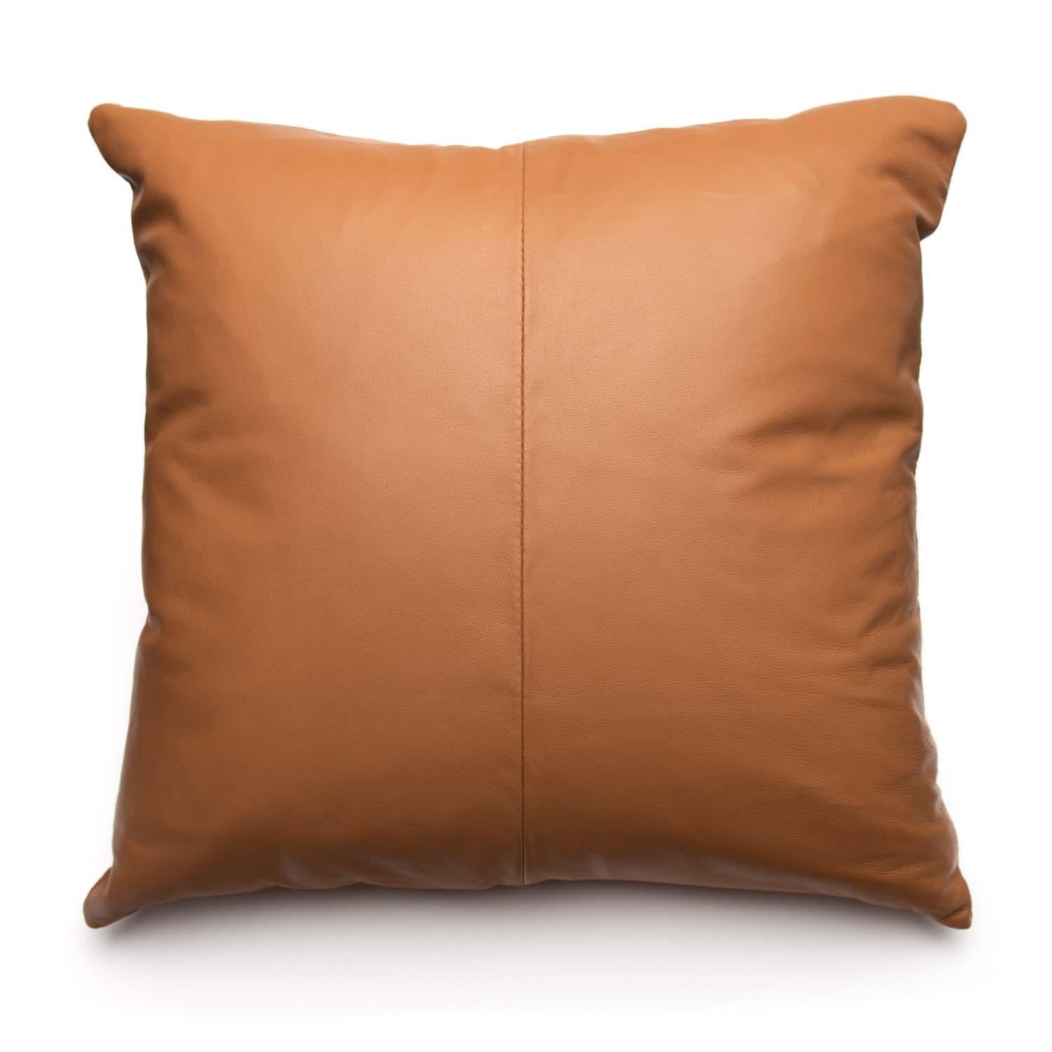 Create a fresh and stylish designer look with this deluxe tan leather pillow. Intricately handcrafted using honored time leather craftsmanship paired back with eclectic contemporary design. Measures: 16 x 16