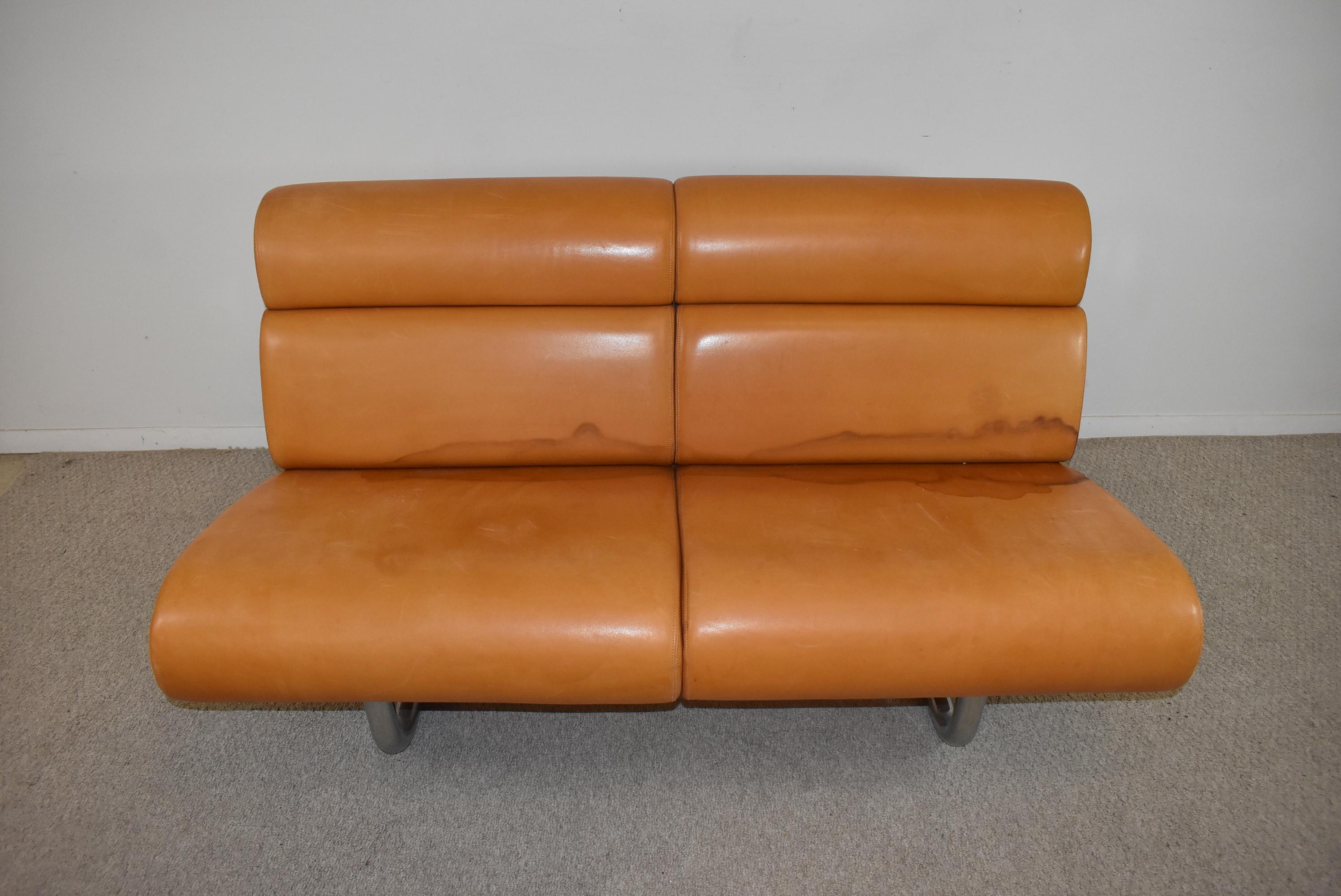 This 1970 sofa designed by Richard Schultz for Knoll features a leather cushioned front and back, and was created with modular sections that hang from a steel tubular frame. 56