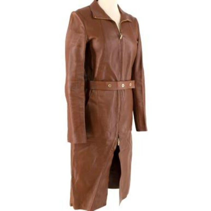 Gucci Tan Longline Leather Jacket
 
 
 
 -Zip fastening along the front 
 
 -Zipped cuffs 
 
 -High collar 
 
 -Snap button belt fastening 
 
 -Gold tone hardware 
 
 -Might weight construction with no stretch 
 
 -Belt loops, unlined 
 
 
 
