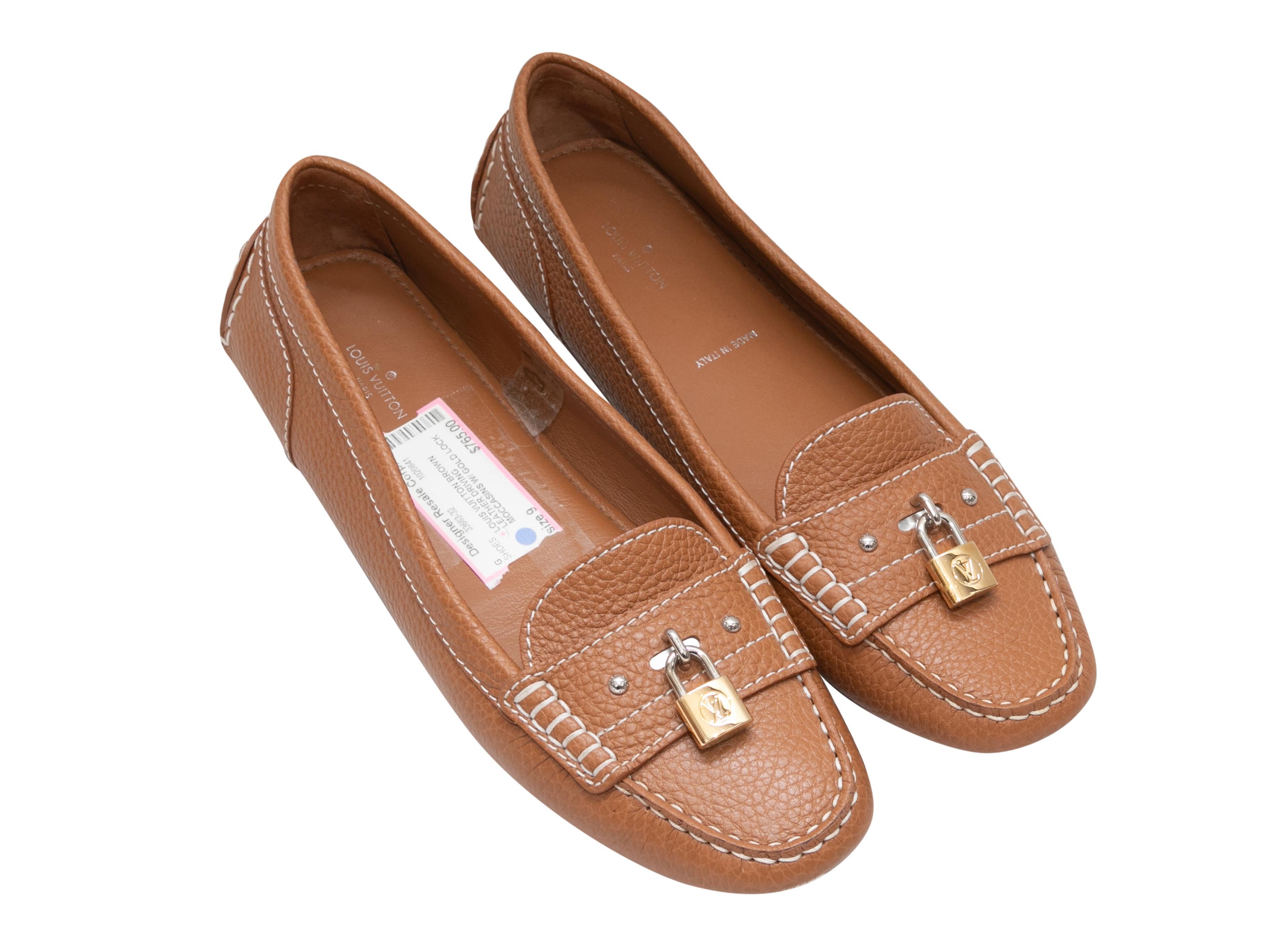 Tan leather Lock-It driving loafers by Louis Vuitton. Gold-tone hardware. Contrast stitching throughout. Rubber bumpers at counters and at soles. 

Designer Size: 39
US Recommended Size: 9 
