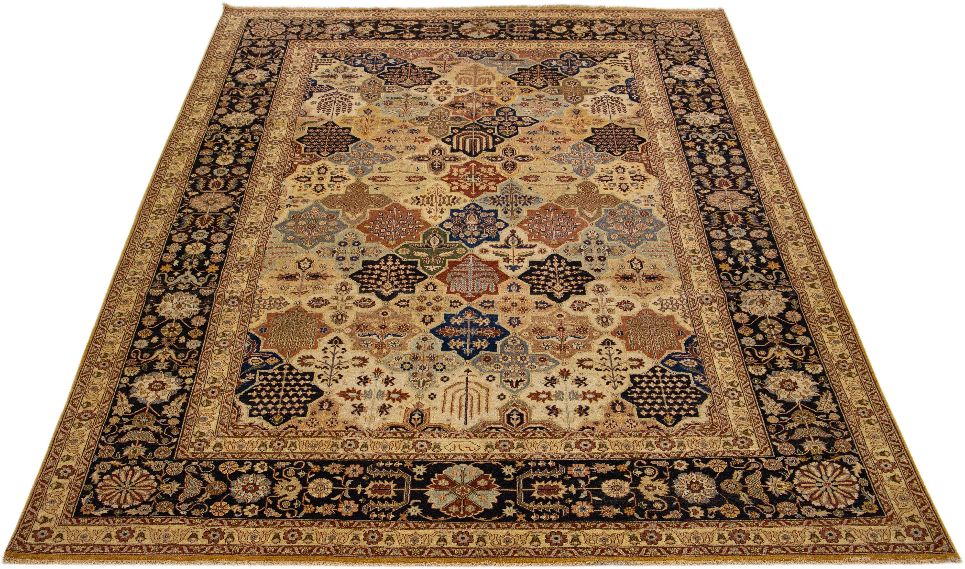Beautiful modern Tabriz-style hand-knotted wool rug with a tan color field. This piece has a dark blue frame, multicolor accents, and a gorgeous all-over floral design.

This rug measures 9'10