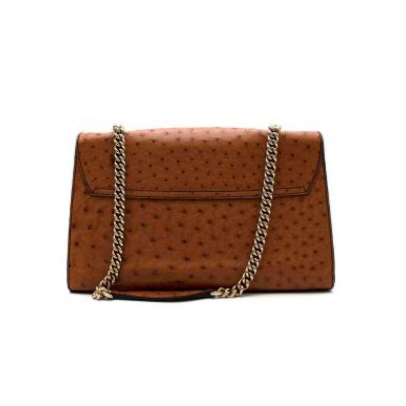 Gucci Tan Ostrich Leather Emily Bag
 
 
 
 -Ostrich skin body with natural texture
 
 -Horsebit and tassel accent on the front
 
 -Gold-tone chain strap
 
 -Three interior pockets 
 
 -Horsebit embellishment 
 
 -Cross-over flap and strap insert
 
