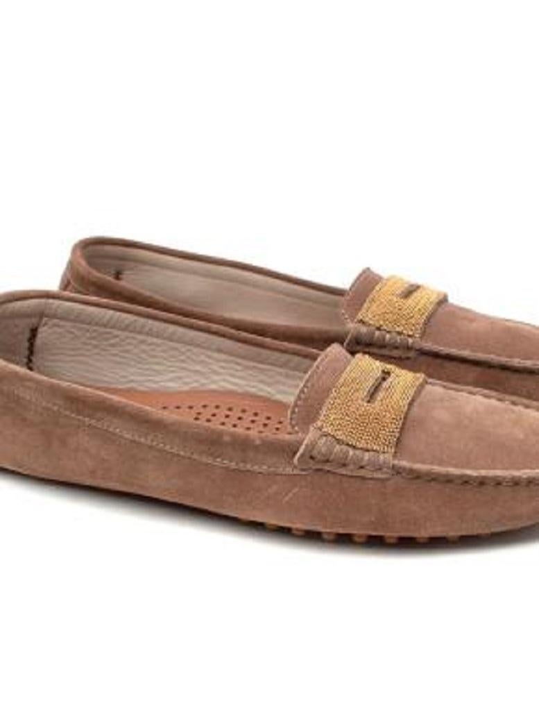 Brunello Cucinelli Tan Suede Monili Embellished Driving Loafers
 
 - Soft suede shell in a light brown hue 
 - Leather lining 
 - Monilli embellishment across the foot strap
 - Injected rubber sole
 
 Materials:
 Leather 
 Suede 
 Rubber 
 
 Made