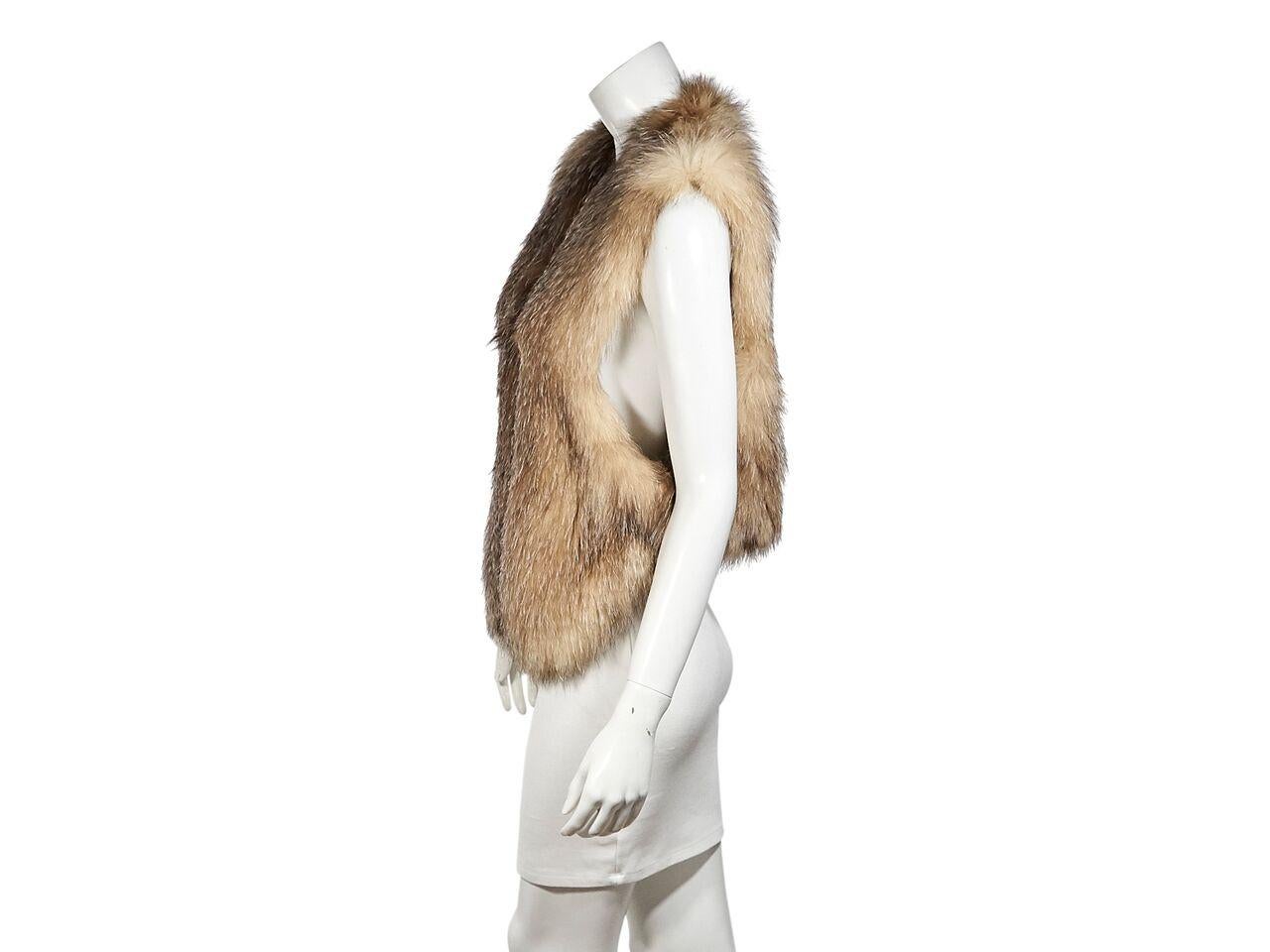 Product details:  Tan fox fur vest by Tamara Mellon.  V-neck.  Sleeveless.  Concealed front closure.  28