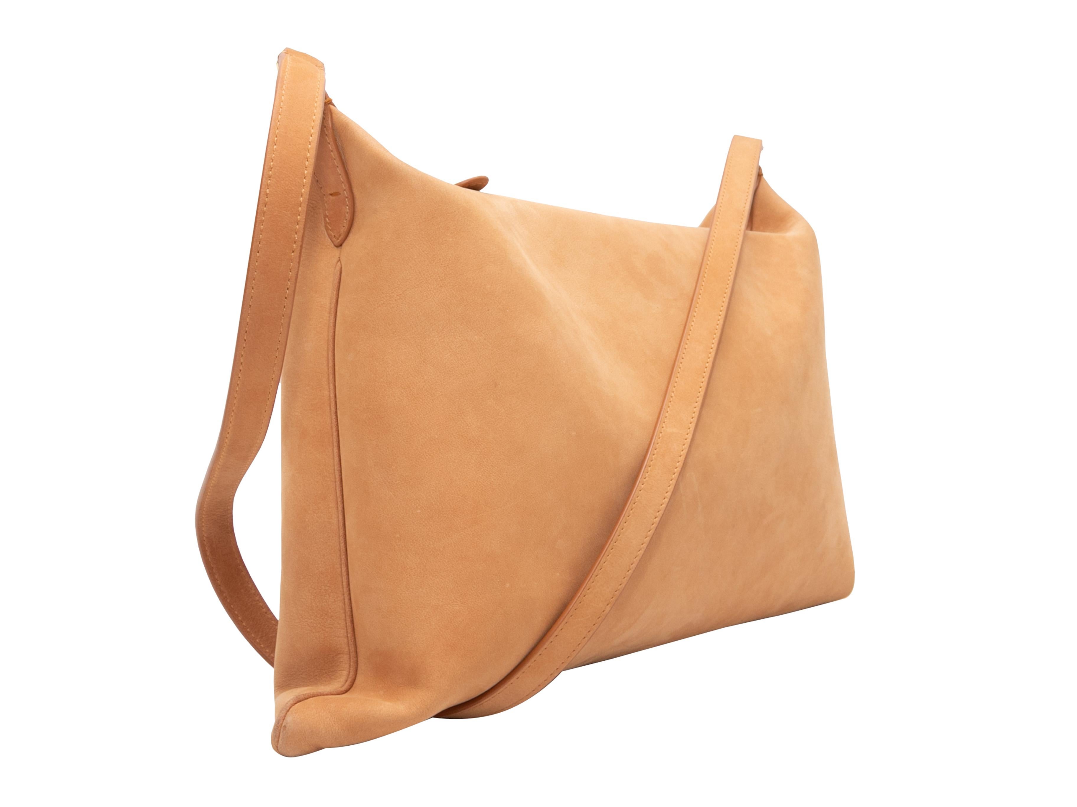 Tan The Row Morgan Leather Shoulder Bag. The Morgan bag features a leather body, gold-tone hardware, a single flat shoulder strap, and a top zip closure. 14