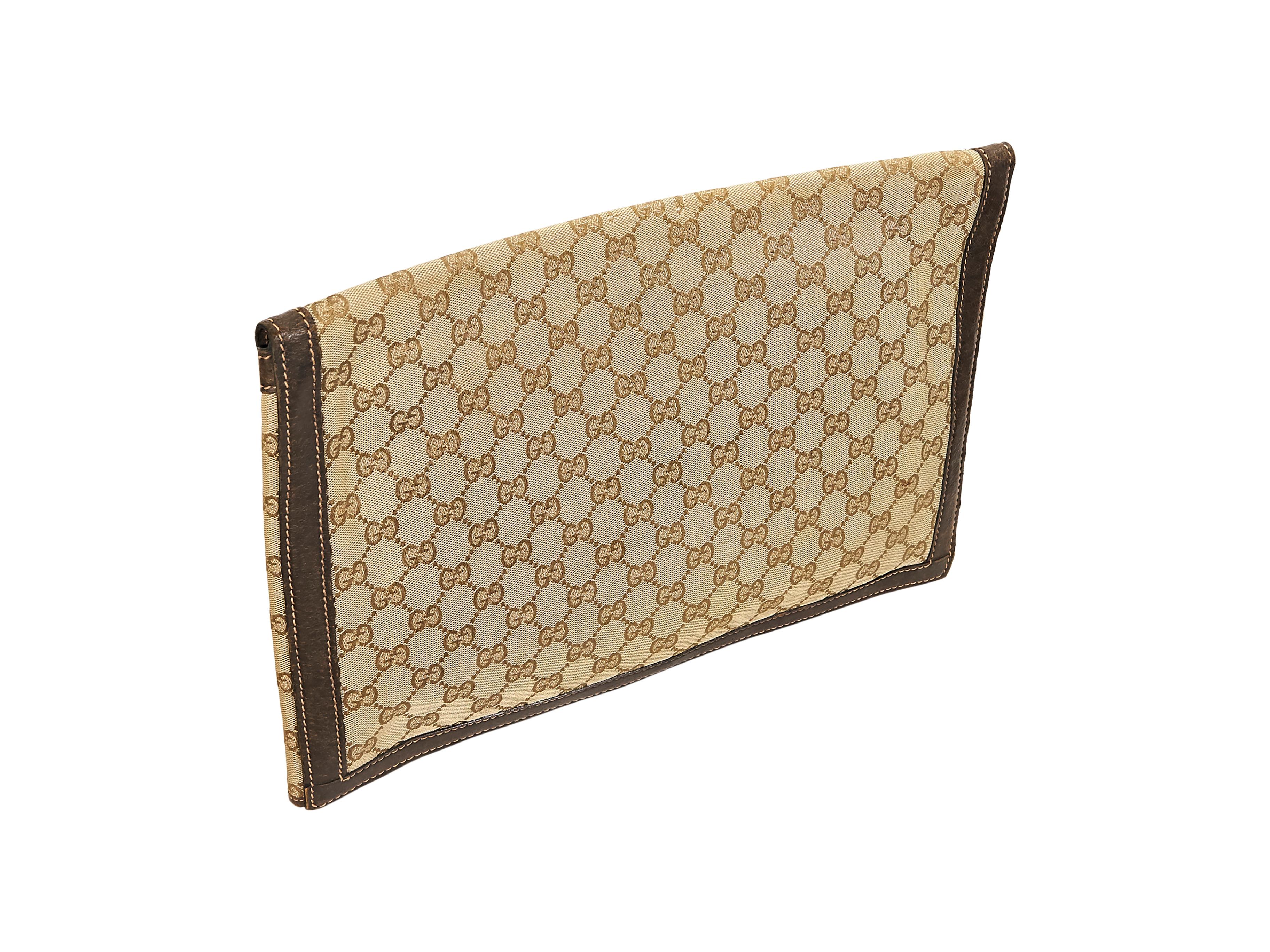 Product details:  Vintage tan logo portfolio pouch by Gucci.  Trimmed with brown leather.  Front flap with push-lock closure.  Goldtone hardware.  15