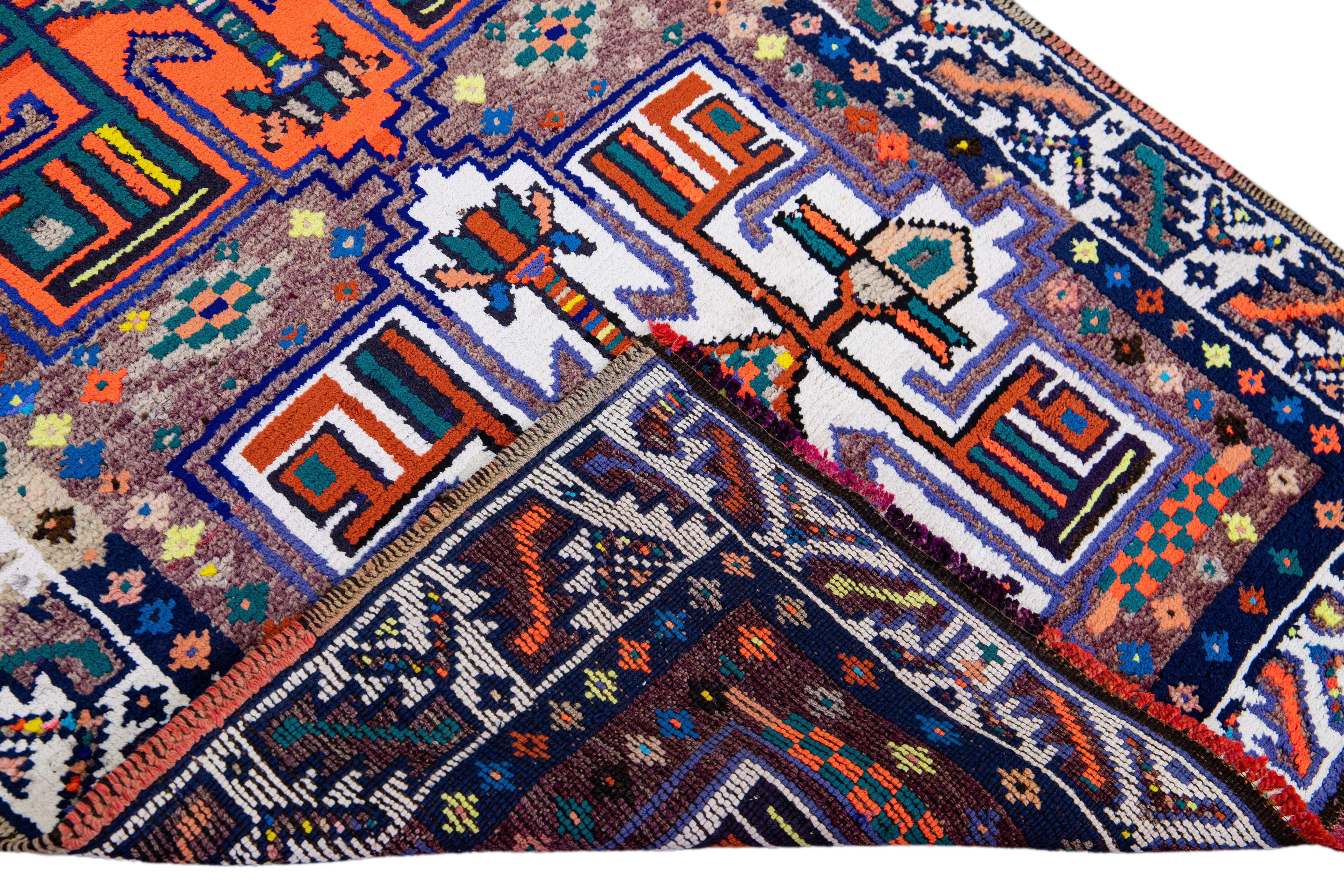 Beautiful vintage Turkish hand-knotted wool rug with a tan field. This rug has a white designed frame and multicolor accents in a gorgeous all-over geometric tribal design.

This rug measures: 3'5