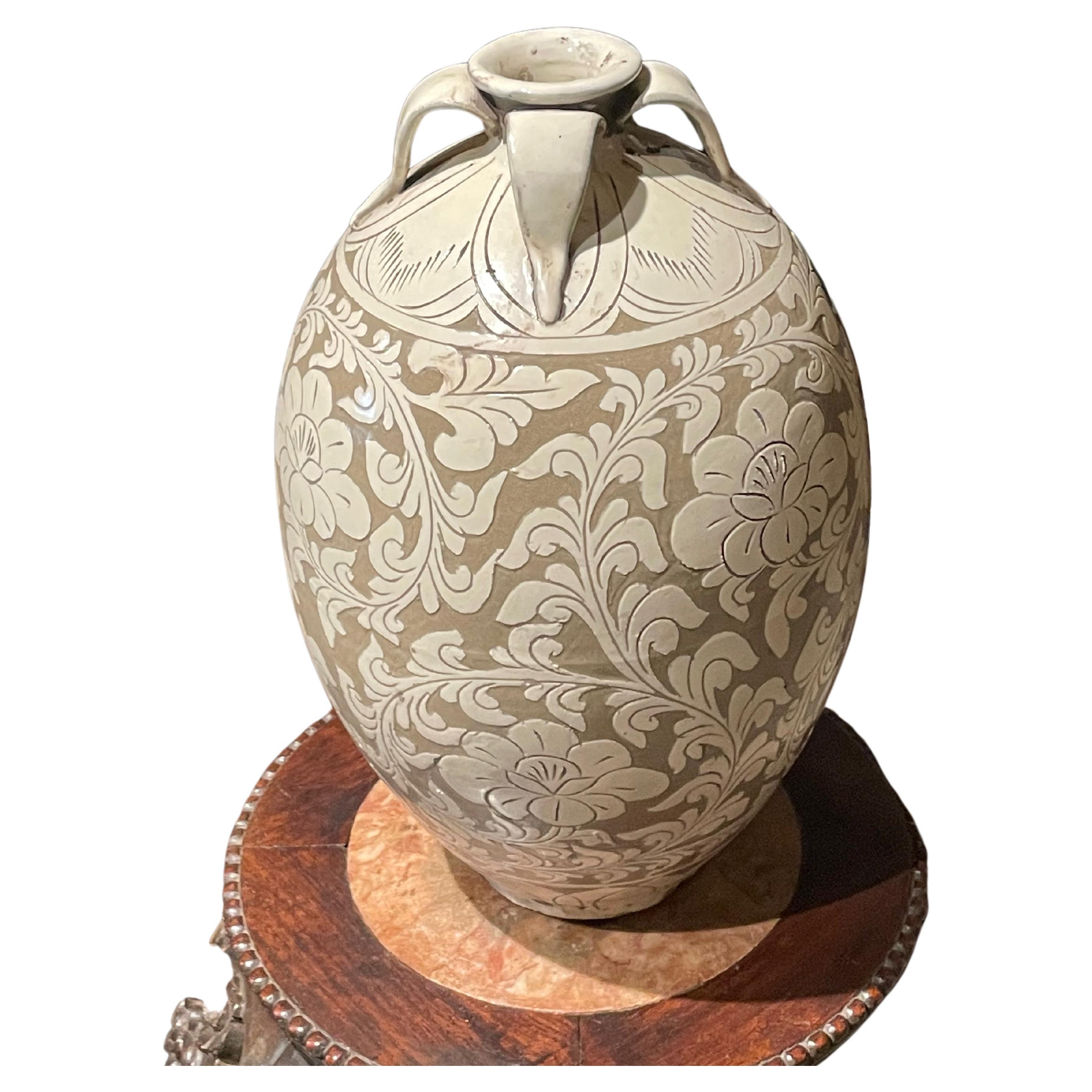 Contemporary Chinese tan ground with cream floral pattern overlay.
Four small handles at opening.
Two available and sold individually.