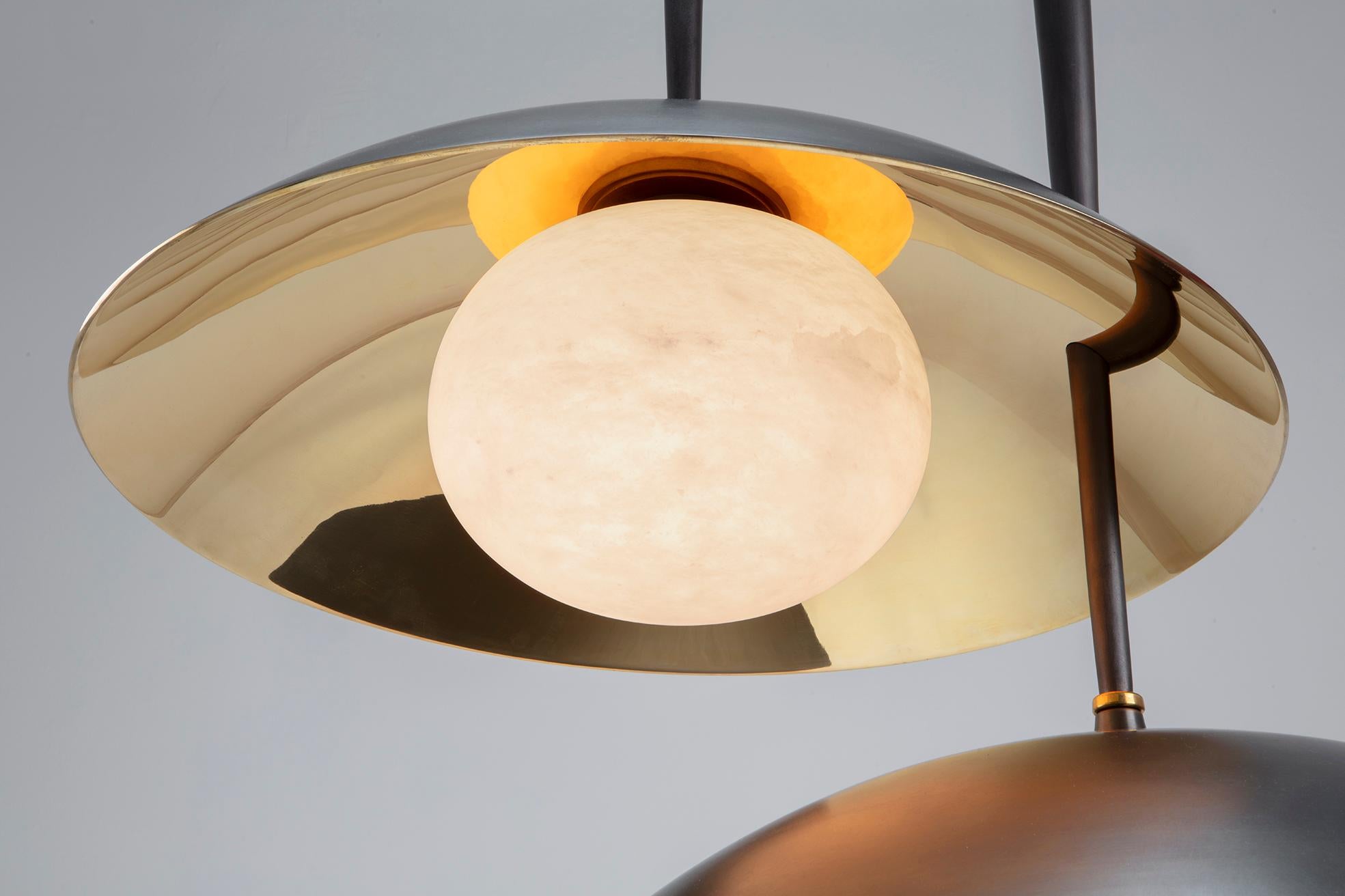 Cast bronze, polished bronze and alabaster pendant. The Tana Pendant is part of the inaugural Alexandra Champalimaud, capsule collection for Charles Burnand. The collection takes its inspiration from the volume and graciousness of North American