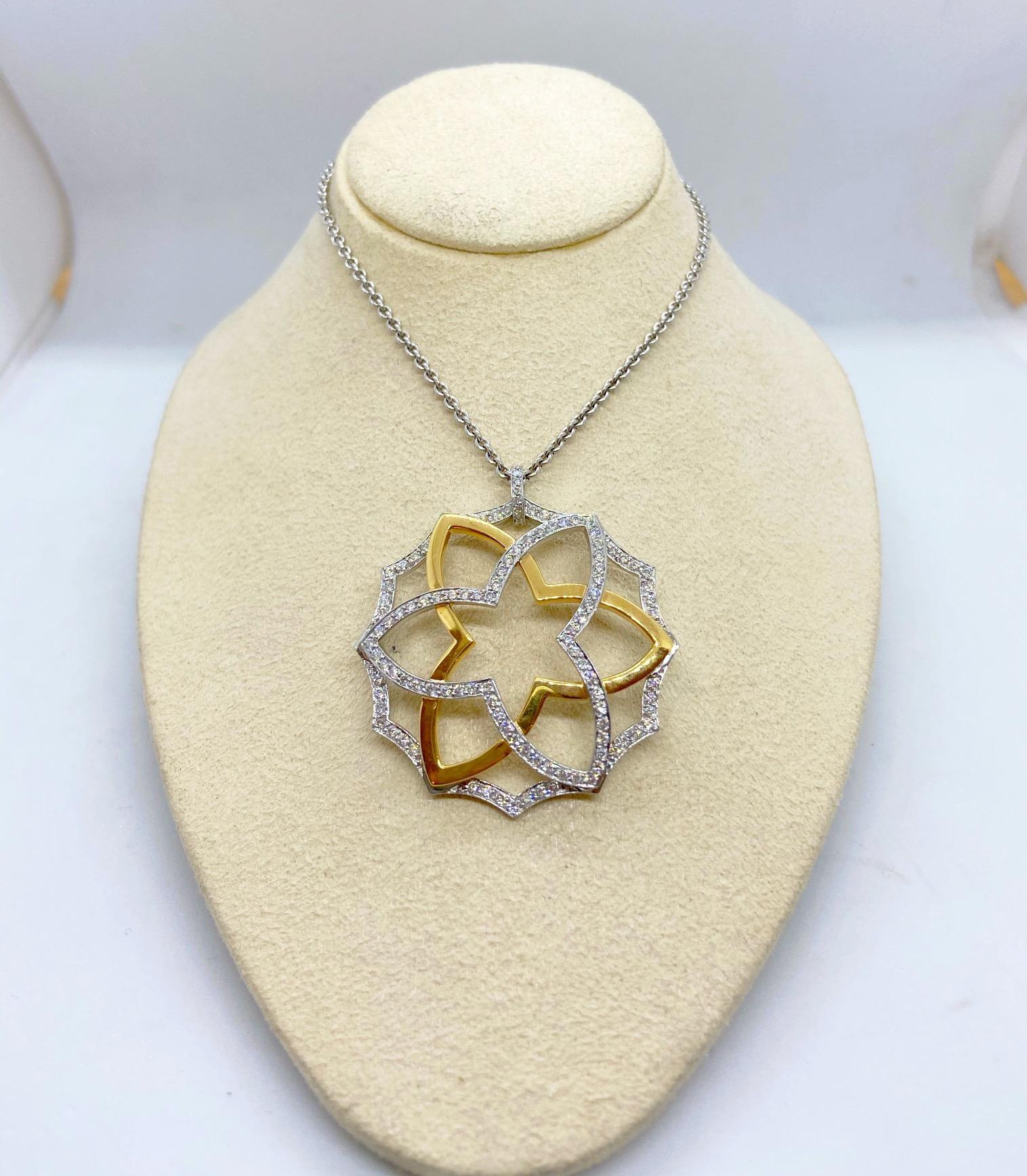 Designed with a combination of 3 layers of 18 karat white and rose gold, this pendant is a modern designed flower from the rose family. The white gold motifs are set with 1.35 carats of round brilliant diamonds. The pendant hangs on a 16