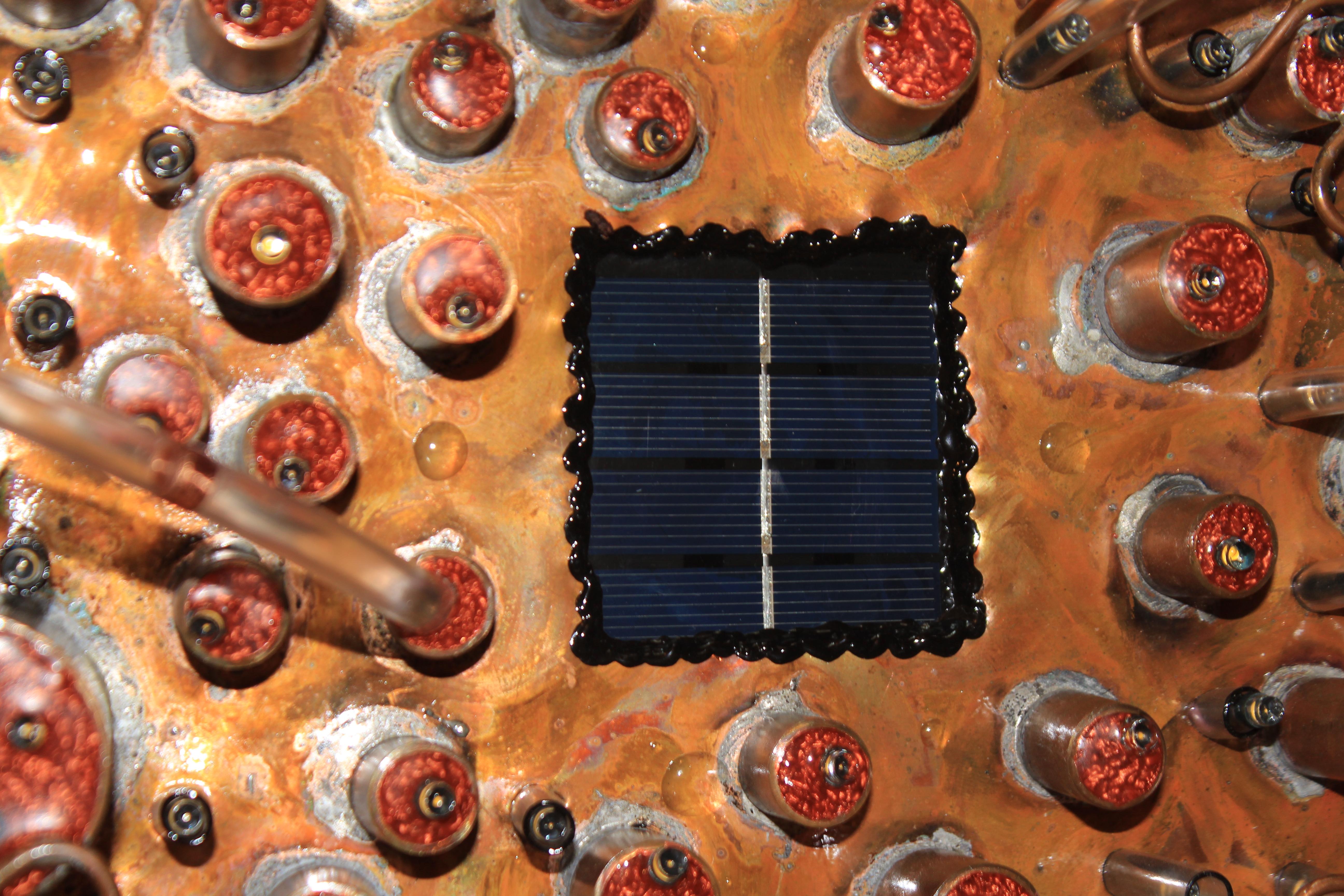 'The Solar Eclipse'

Size 18 x 18 x 7 inches (46 x 46 х 17 cm).

Materials: copper, solar battery light, pvc.

You can hang it on the hook on the screws, or nails or hang it by a string. The weight is 3 kg (6,5 pounds).

The sculpture is a part of