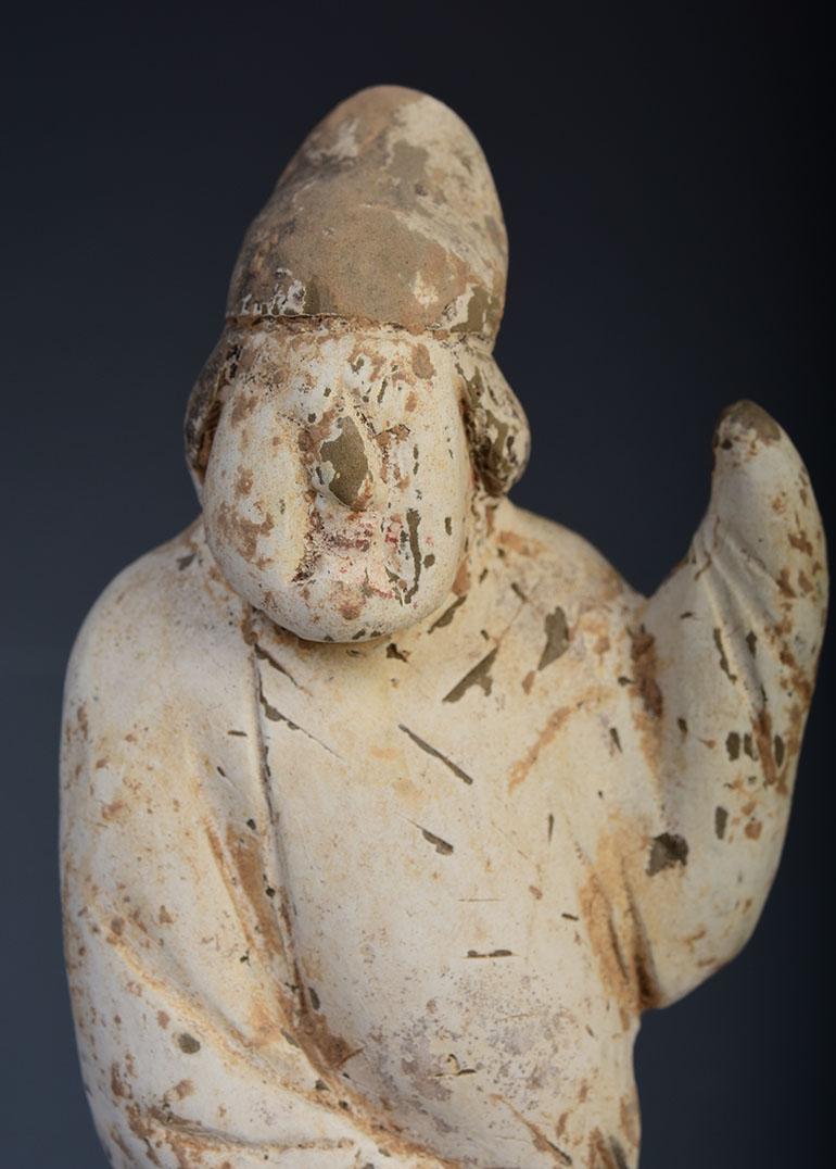 Chinese pottery male attendant figure.

Age: China, Tang Dynasty, A.D. 618 - 907
Size: Height 17.6 C.M. / Width 5.5 C.M.
Condition: Well-preserved old burial condition overall with some amount of soil adhering.

100% satisfaction and authenticity