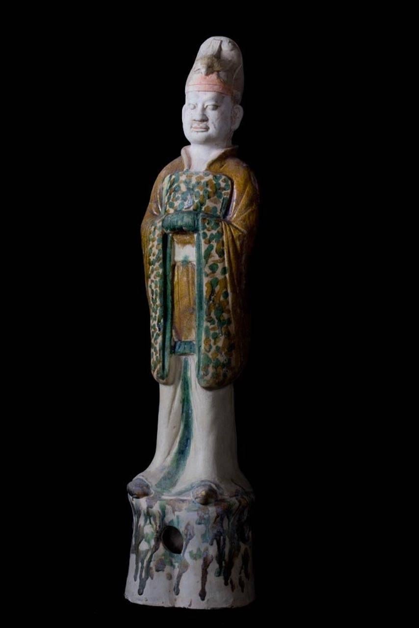 A Tang dynasty sancai (three color) glazed pottery model of a Taoist official, TL tested by Ralf Kotalla - worldwide oldest private laboratory specialized for genuine thermoluminescence test analysis in Germany. 

The figure is portrayed standing