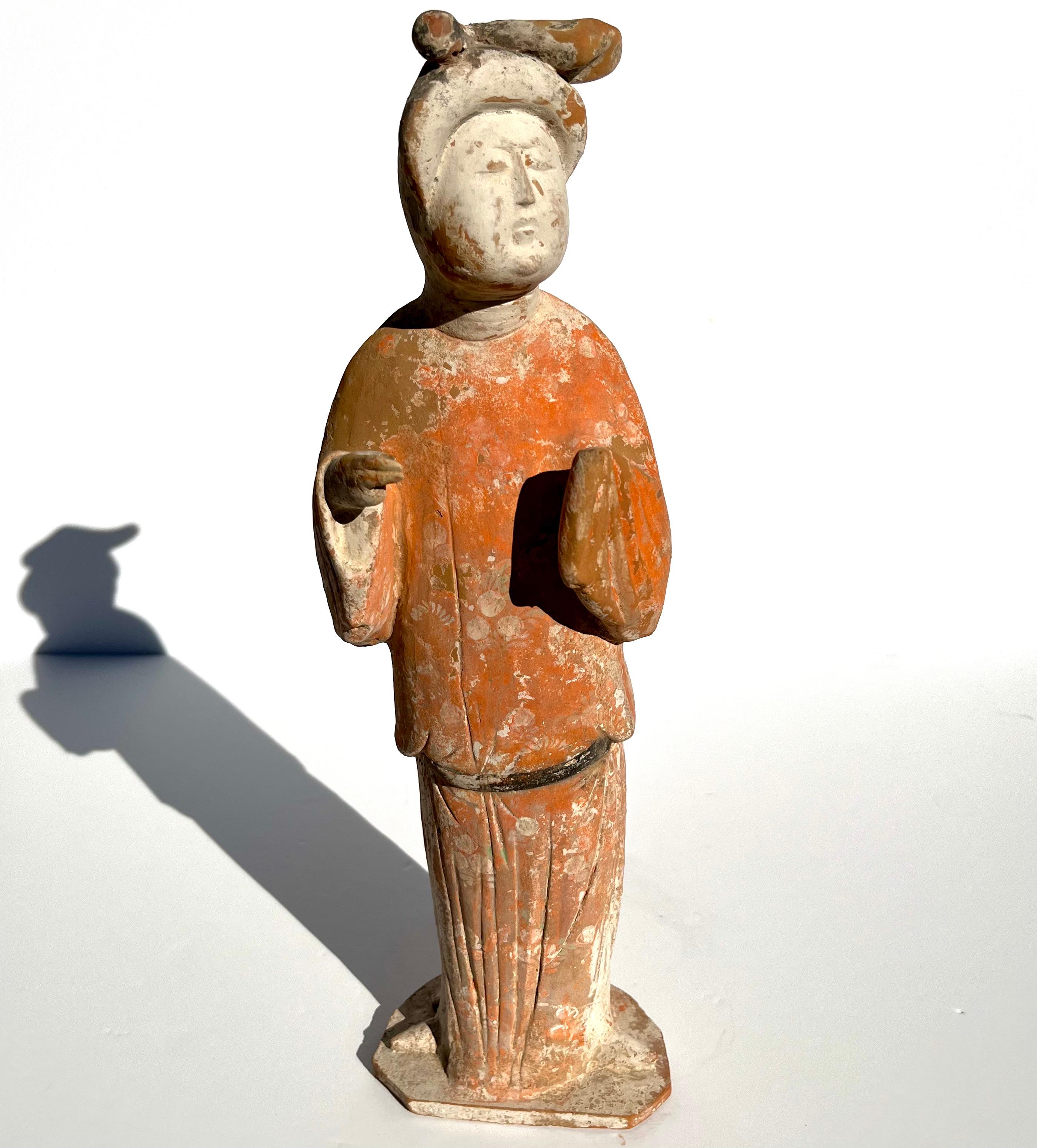 Tang Dynasty Painted Pottery Figure of a Fat Lady or Female Courtesan.
Period (618 - 907AD)

Estate / Collection: The Collection of Jay I. Kislak sold to benefit the Kislak Family Foundation

A painted pottery fat lady in orange an white robe with