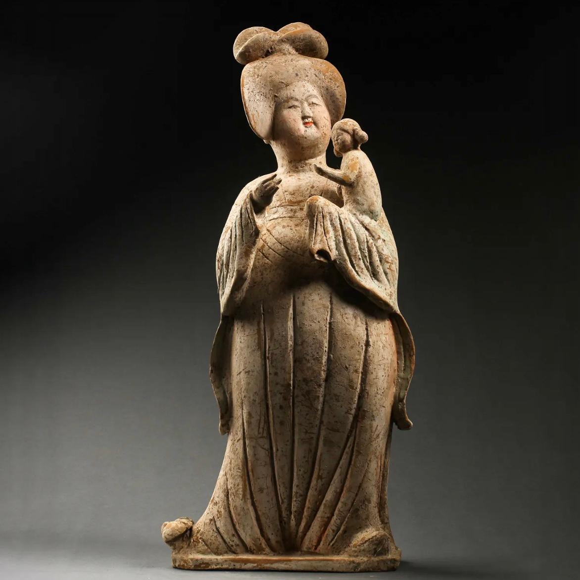 Tang Dynasty polychromed fat lady with child in arm. TL Tested
Terracotta, pottery with traces of orange and green paint 
Sui to Tang Dynasty (581-618)
Measures: Height: 20.2 inches (51cm)
Width: 9.45 inches (24cm)
Guaranteed Authentic with