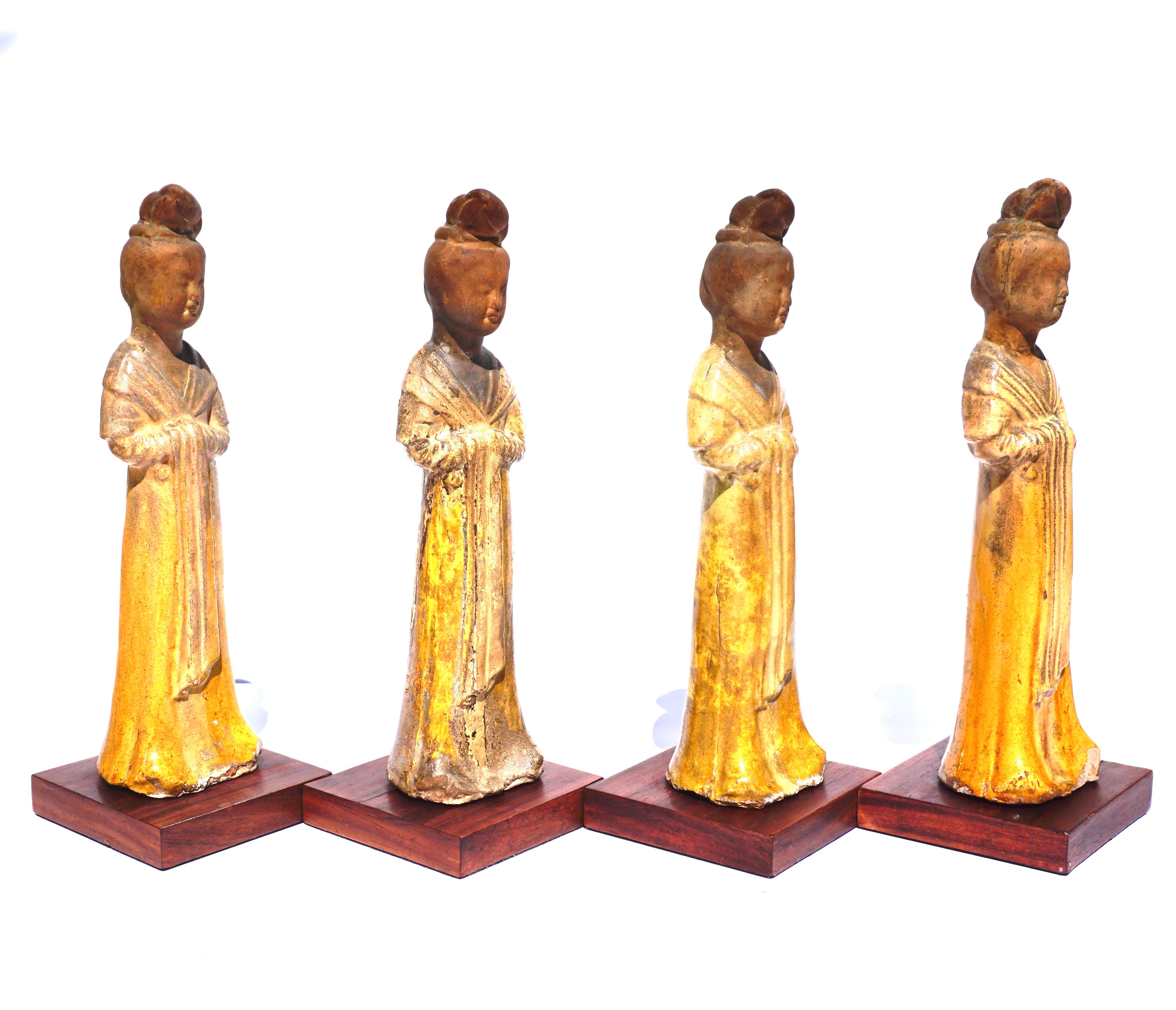A set or four (4) glazed pottery courtesan tomb attendants from the Tang Dynasty. It is usually a treat when you find a pair of these Minqui figures but when you have four; the display is even more formidable. These requisites for the after life