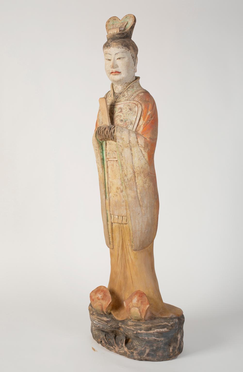 Provenance: a Park Avenue collection

Chinese Tang Dynasty painted pottery figure of a standing official. This tomb burial figure was made as part of a large group of objects to accompany the dead into the afterlife with all they had in life. Only