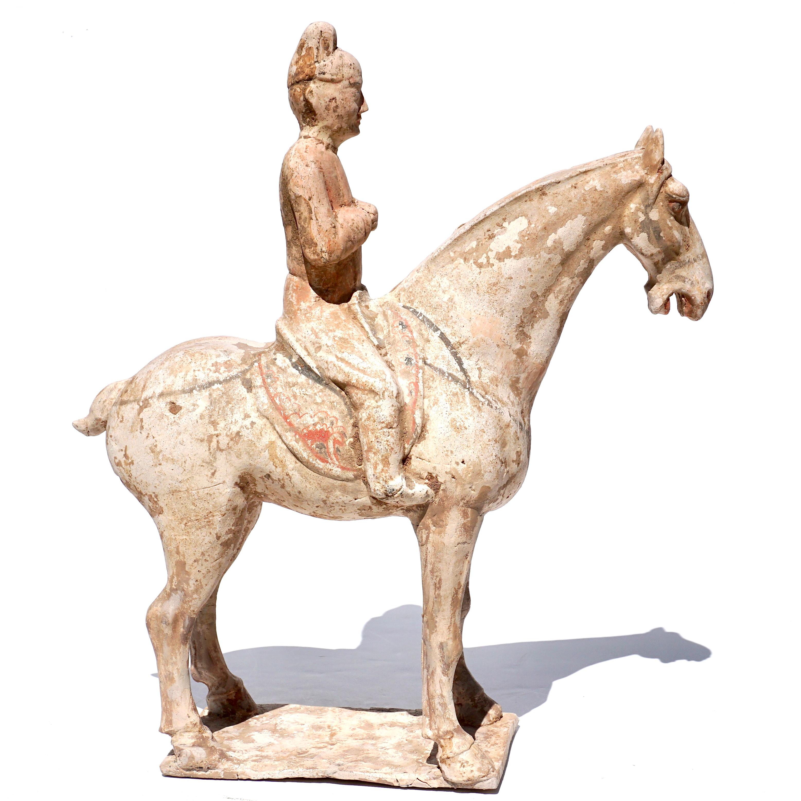 Tang Dynasty Horse and Rider. China (618-907 AD)

During the Tang Dynasty, horses were revered creature, considered relatives of the mythical dragon. This veneration was well earned, for the speed and stamina of these majestic animals ensured the