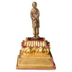 Tang Or Later Solid Cast Bronze Monk With A Vase With Remains Of Rich Gilding