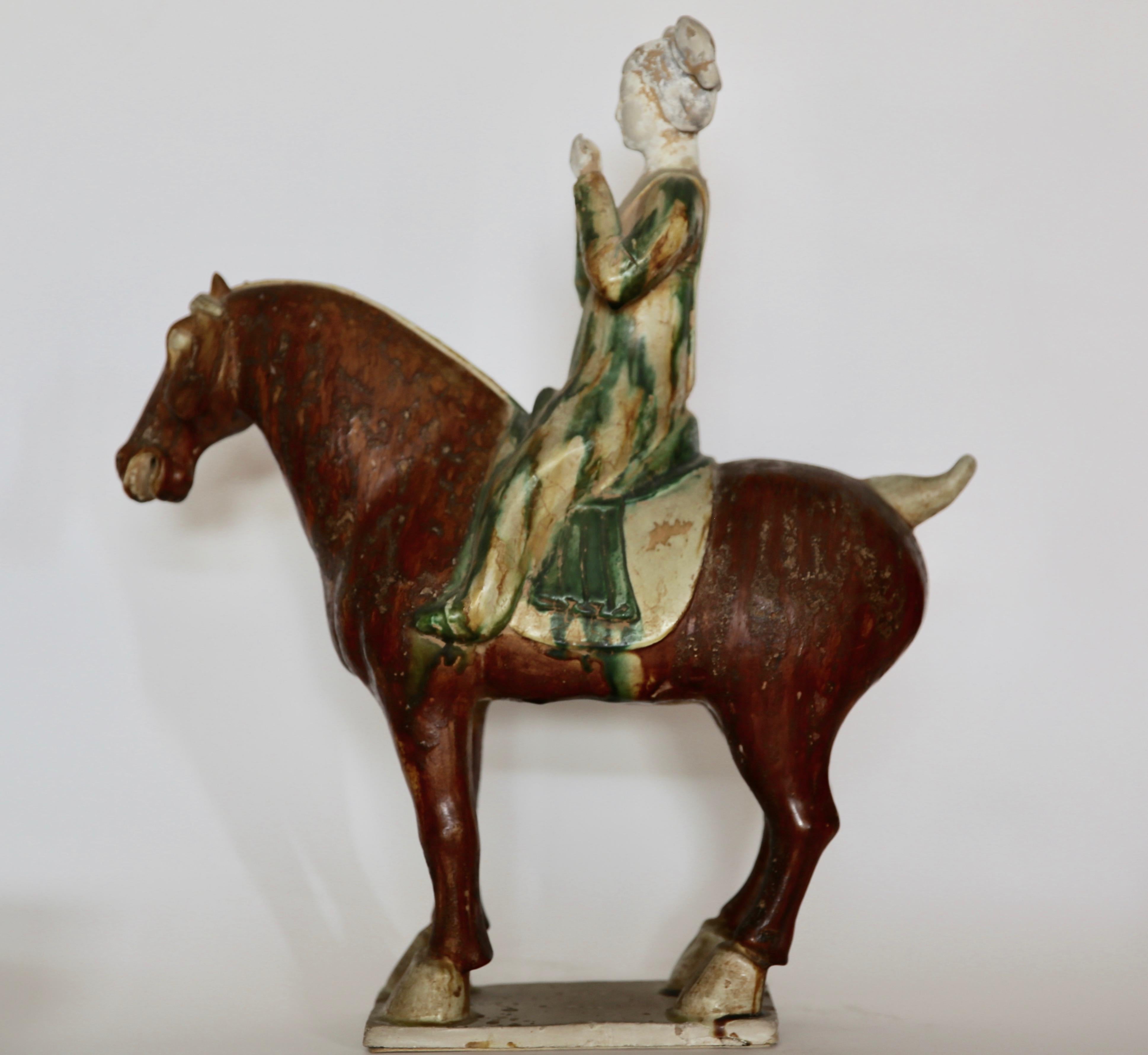 Sancai glazed terracotta tang horse with musician.
Great antique condition.
Dimensions: 47 cm x 41 cm x 16 cm.