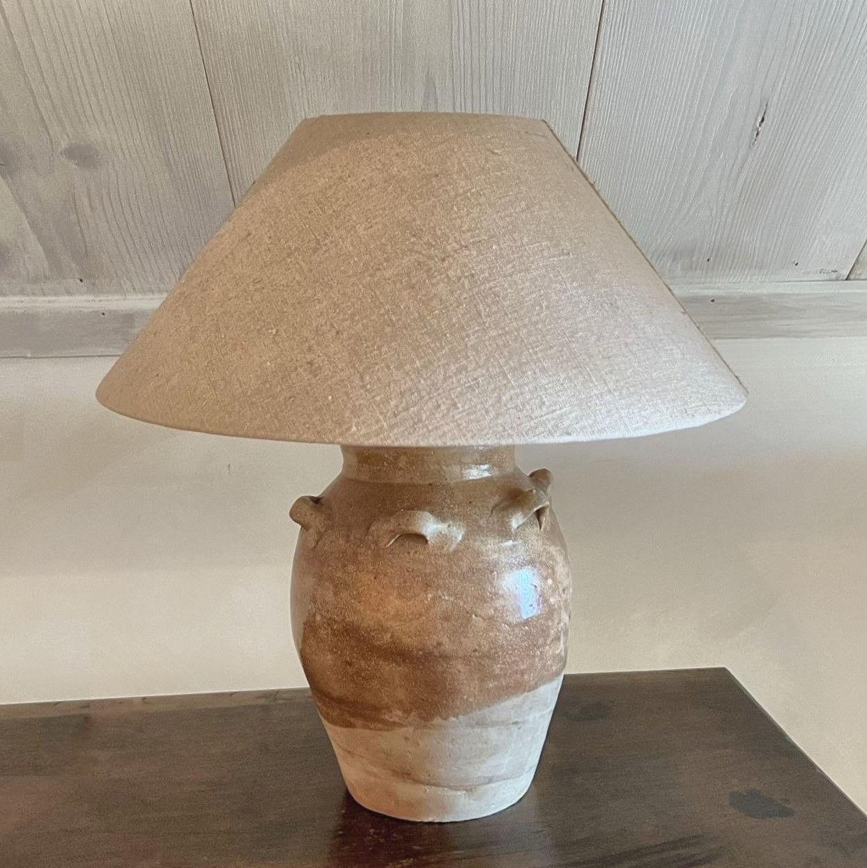 A 19th century halfglazed brown Tang style pot turned in to a table lamp. The pot with beautiful proportions and an attractive color and patina.